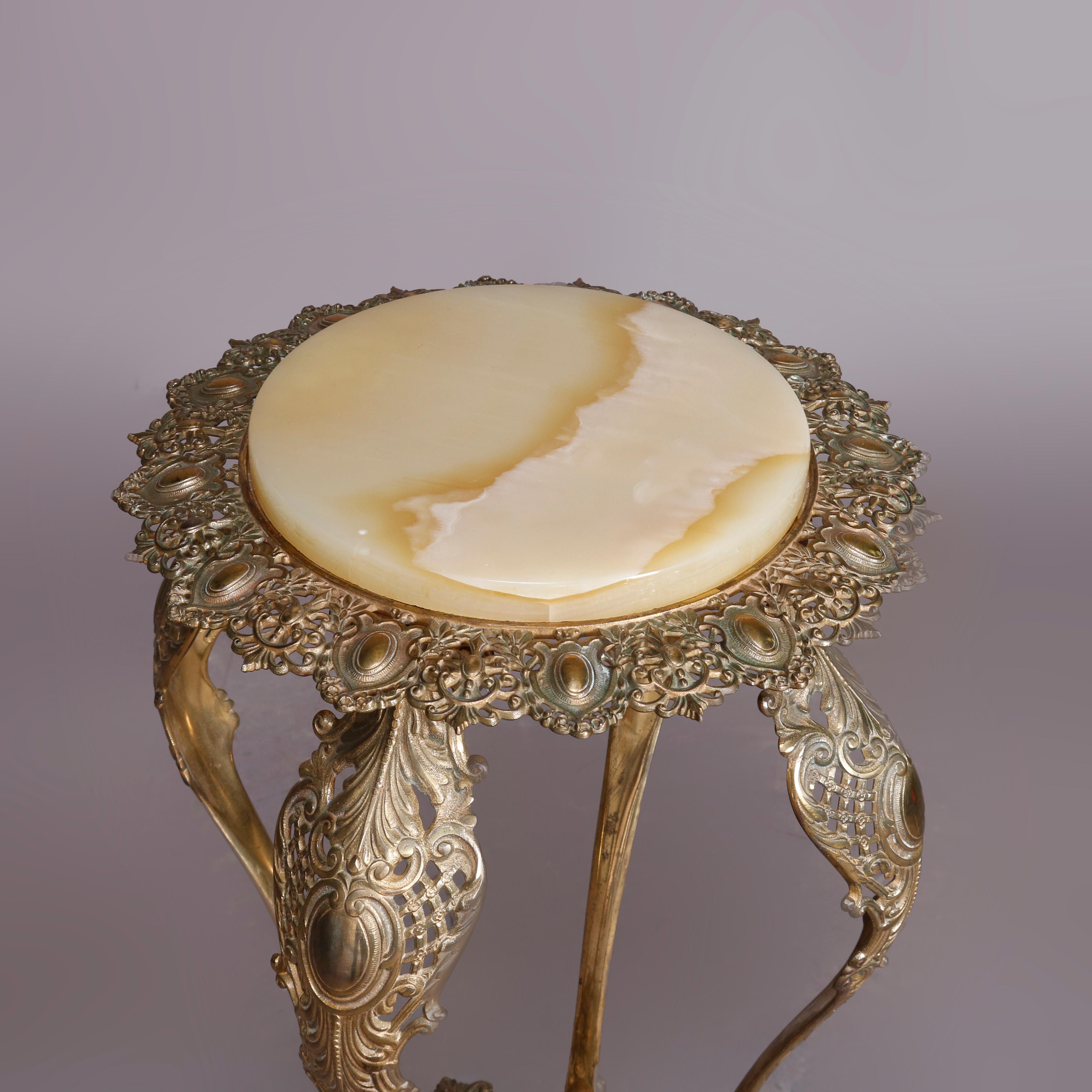 An antique French Louis XIV plant stand offers gilt bronze frame with top having marble top with pierced foliate surround raised on exaggerated cabriole legs with pierced foliate knees and lower shelf, circa 1880.

Measures: 31.5
