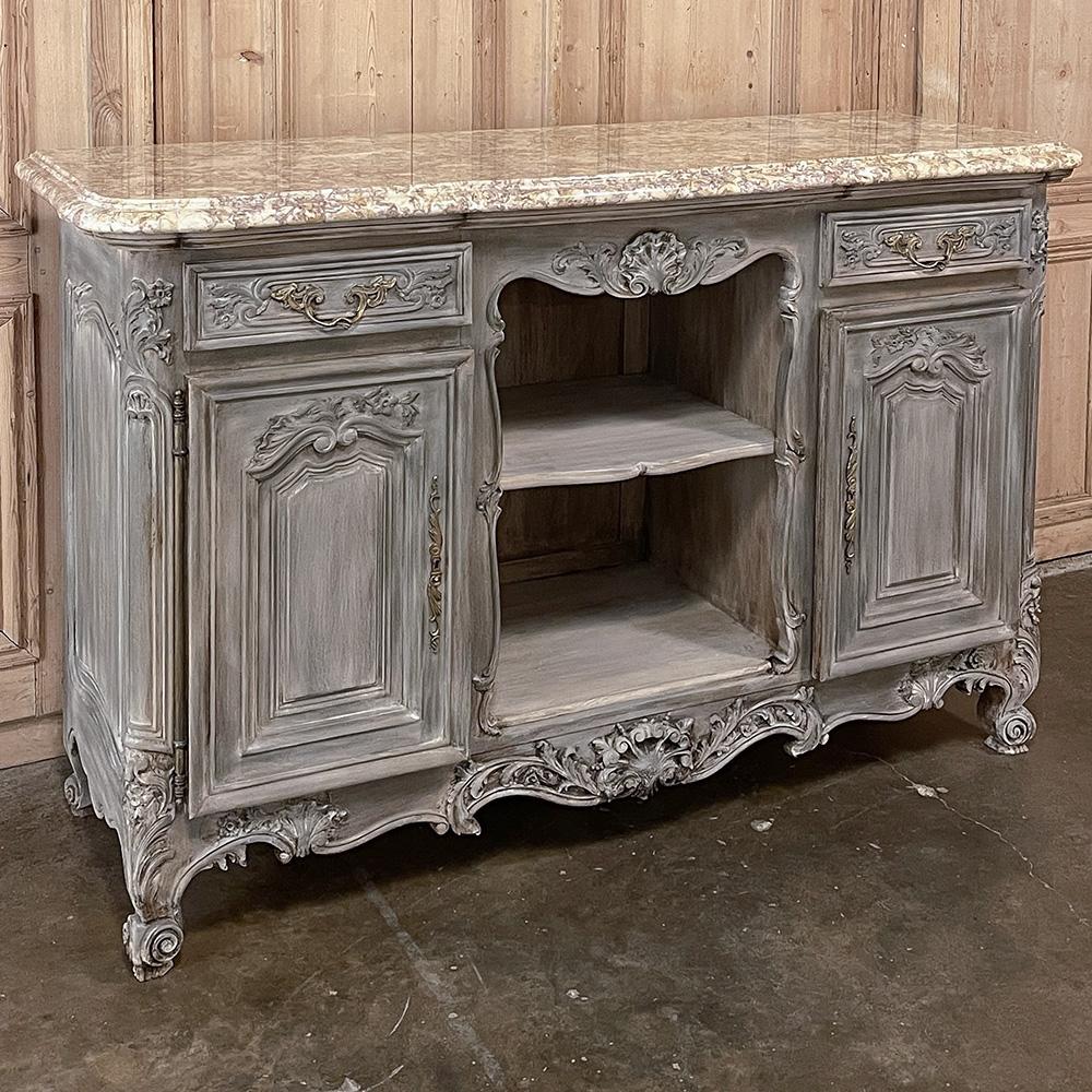 Antique French Louis XIV Gray Washed Fruitwood marble top buffet is a superlative example of fine French craftsmanship created from luxurious indigenous fruitwood and topped with elegant contoured and beveled marble with brass hinges, key guards and