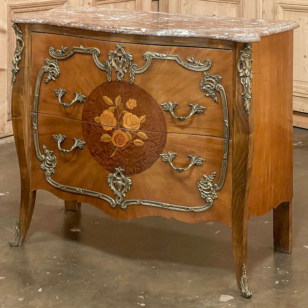 Antique French Louis XIV Marble Top Marquetry Bombe Commode is one of the more remarkable examples we've seen in recent years, featuring a very subtle curvaceousness combined with exquisitely cast bronze mounts to make a keepsake that would make the