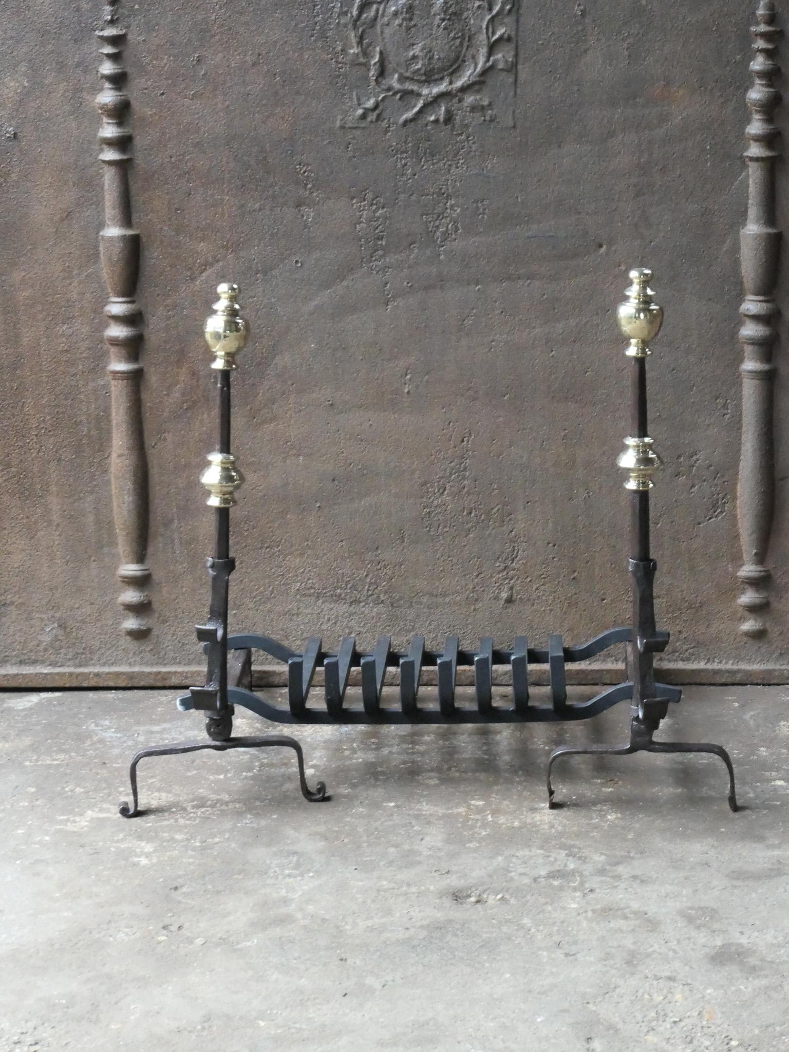 Beautiful French 17th century fireplace basket or fire grate from the Louis XIV period. The fireplace grate is made of wrought iron and bronze. The condition is good. The total width at the front is 27.0 inch (68.5 cm).



















 
