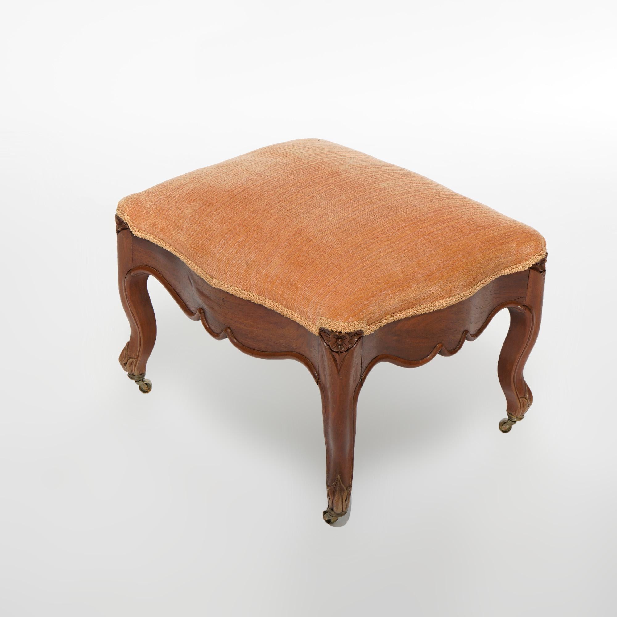 An antique French Louis XIV footstool offers upholstered seat over carved walnut base having shaped skirt and raised on cabriole legs,
c1890

Measures- 13''H x 18.5''W x 15''D.

Catalogue Note: Ask about DISCOUNTED DELIVERY RATES available to most