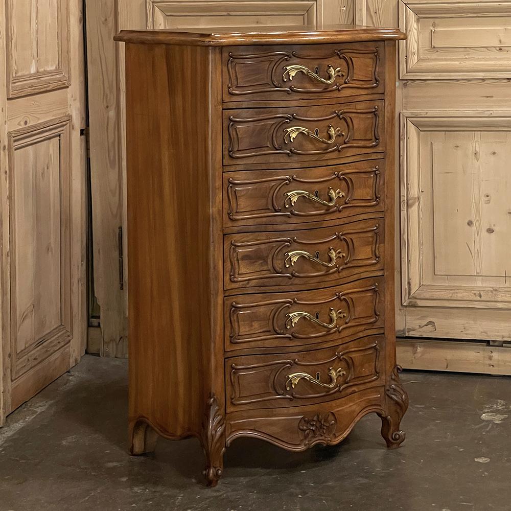 Antique French Louis XV blonde walnut serpentine chiffoniere is the perfect choice for a cozy room or niche, creating a visual feast for the eyes while simultaneously providing six drawers of storage! Hand-crafted and carved from select blonde
