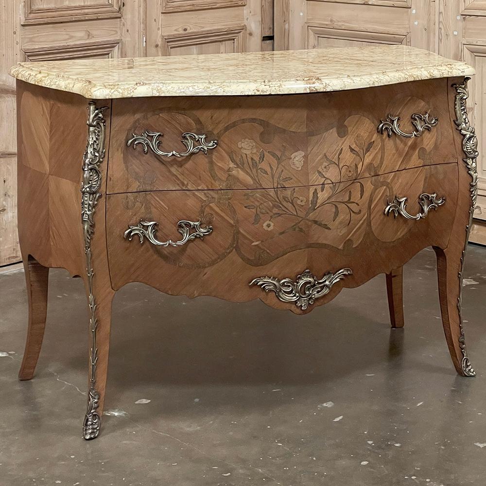 Requiring the talents of four master artisans, Antique French Louis XV Bombe Marquetry Marble Top Commodes such as this example needed a talented menuisier to create the complex naturalistic, curved form of the casework utilizing time-honored