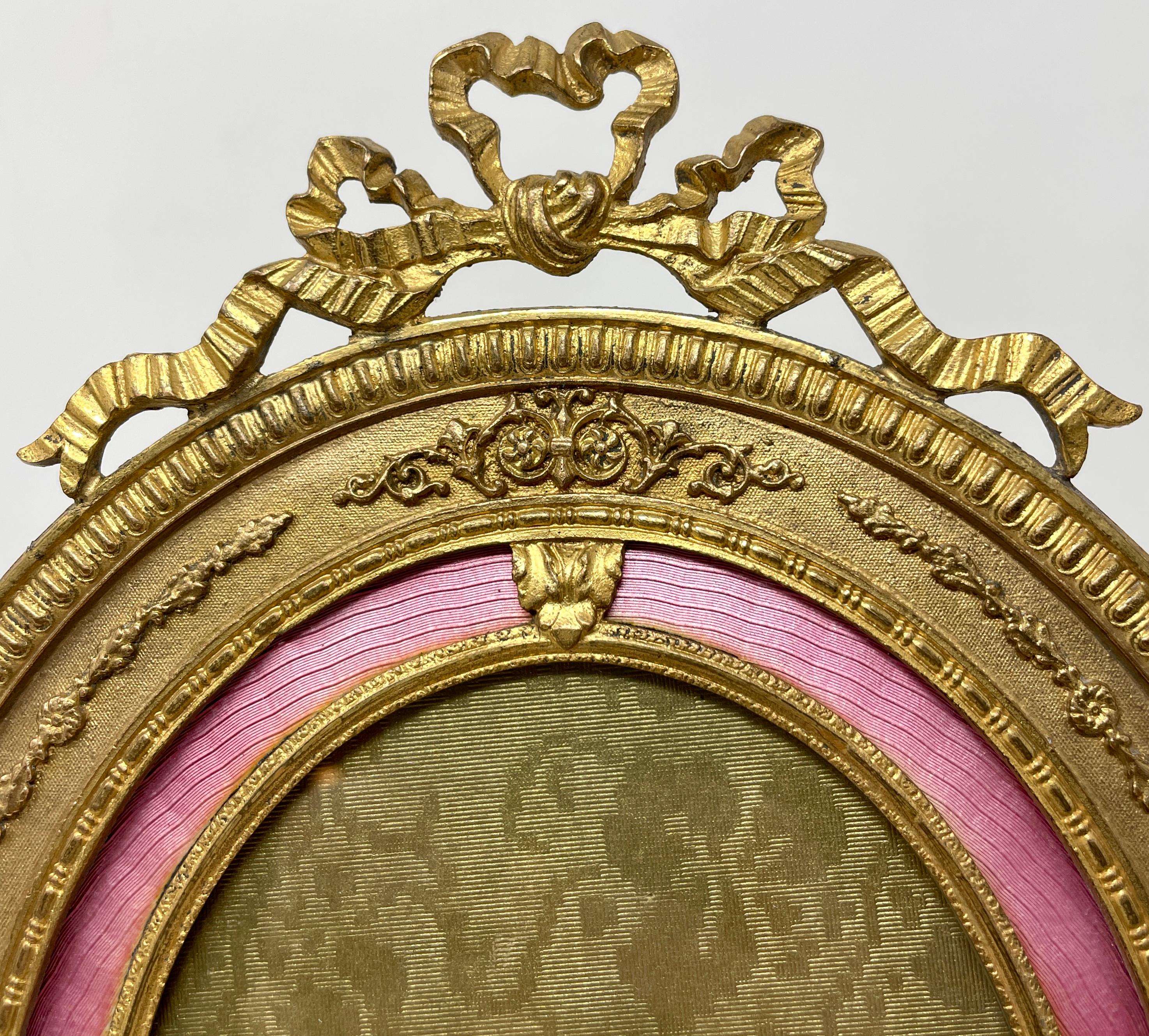 Antique French Louis XV style bronze d' ore enamel desktop picture frame. 
Photo size: 4 inches wide x 5 inches tall