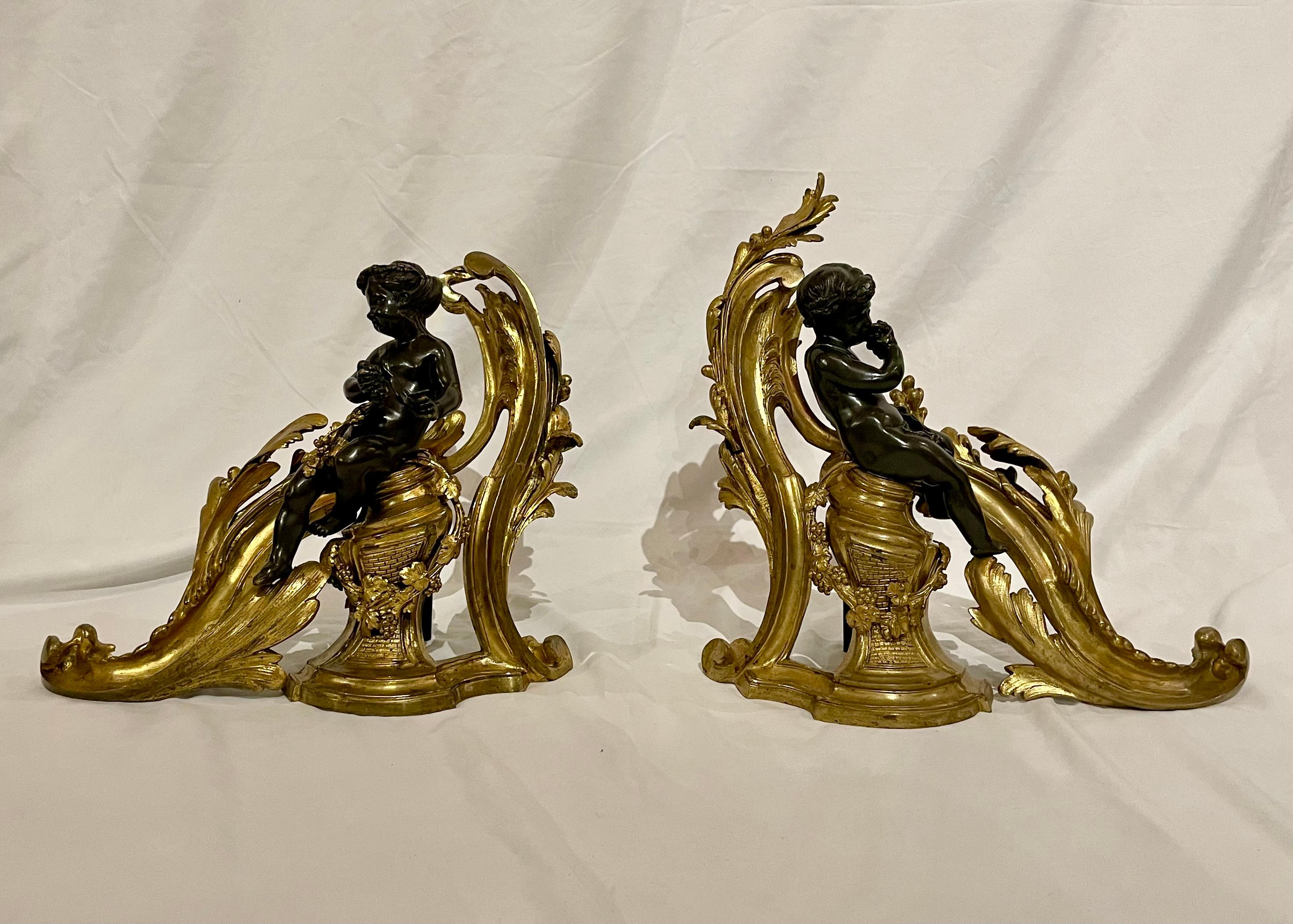 Antique French Louis XV Bronze D'Oré and Patinated Bronze Chenets with Figural Putti, Circa 1880.