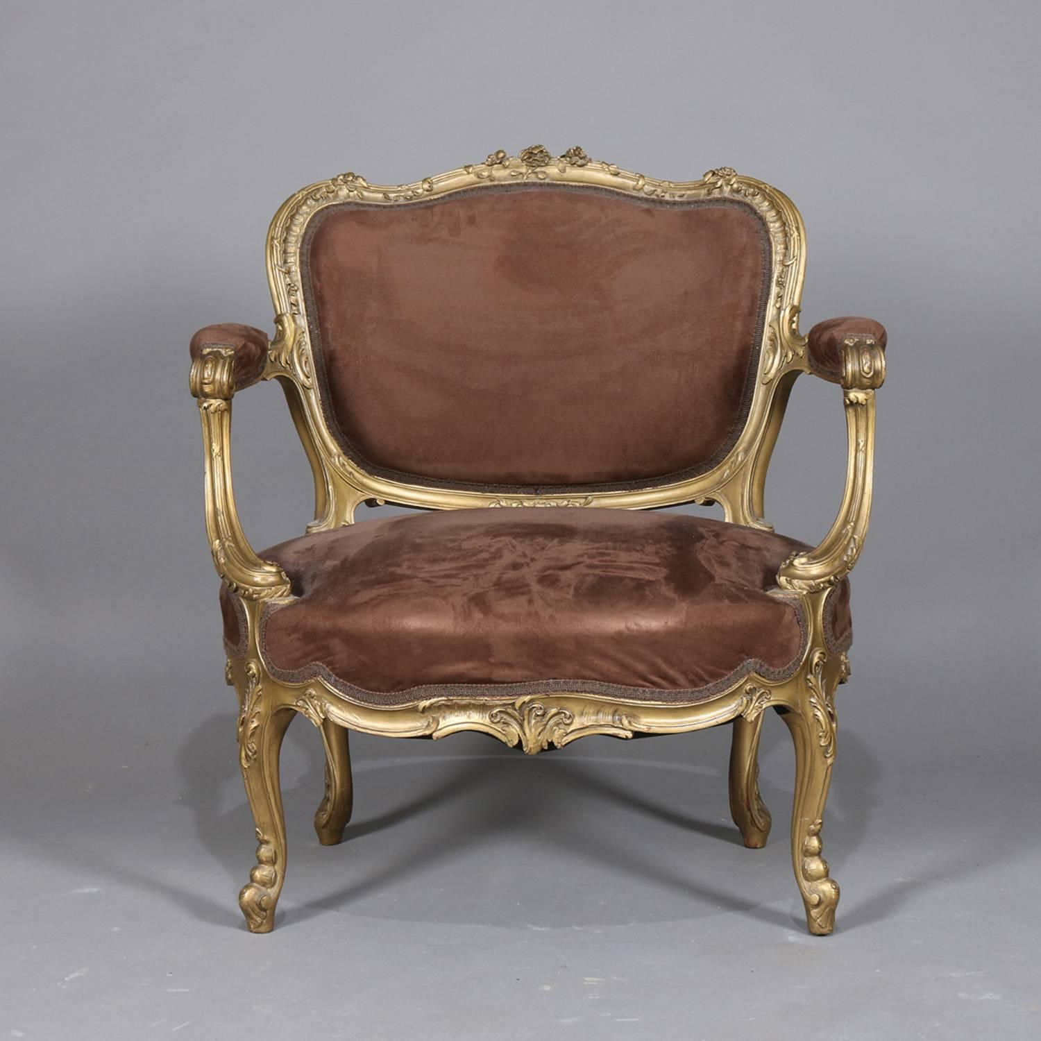 Antique French Louis XV oversized fauteuil features foliate, floral and scroll giltwood frame with upholstered seat, arms and back, sized at that of diminutive settee (seat and 1/2), 19th century


Measures: 33.5
