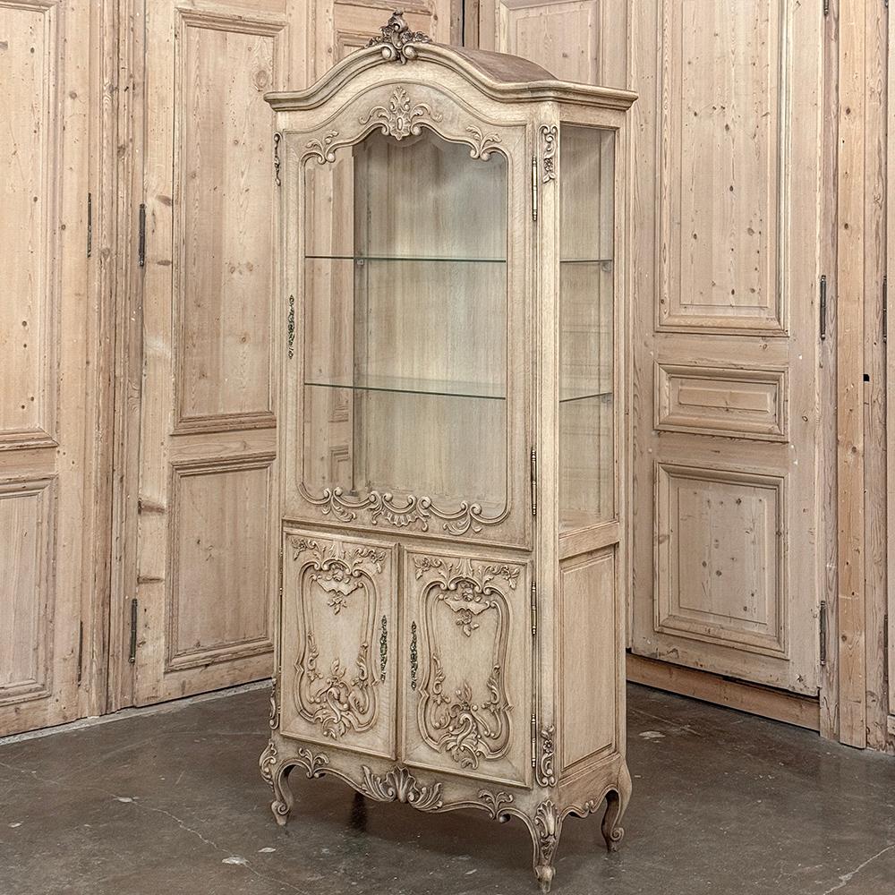 Antique French Louis XV Carved Vitrine ~ Curio Cabinet will make a splendid display case for your most cherished family heirlooms and collectibles.  Hand-crafted and meticulously carved from select white oak, it features styling inspired by the