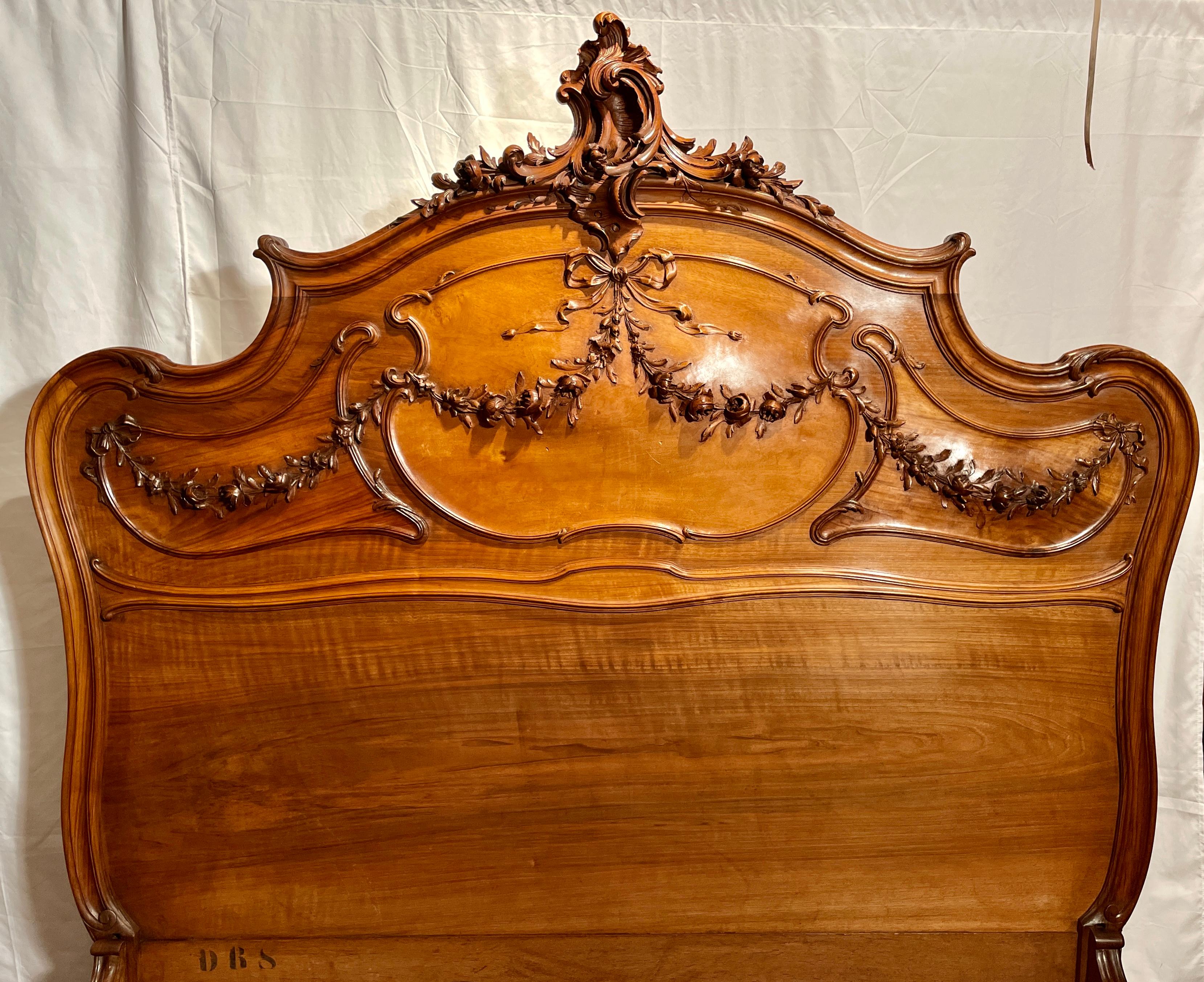 Antique French Louis XV 4 piece carved walnut bedroom suite signed Frédéric Schmit of Paris, Circa 1890. 
*Per last 3 photos the two nightstands have removeable tops.

Dimensions: 
Bed exterior: 66 inches high x 63 inches wide x 84 inches deep