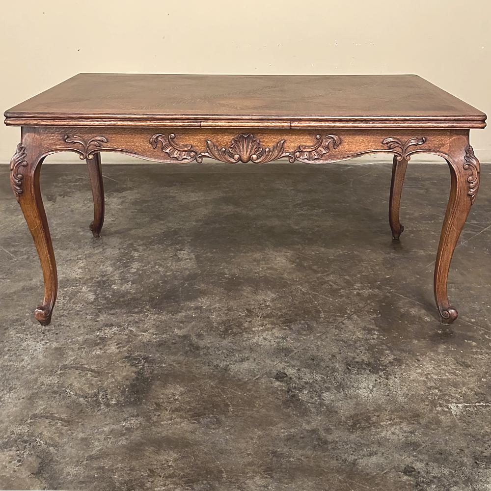 Antique French Louis XV Draw Leaf Dining Table is a classic example of one of the most versatile tables you'll ever own!  Sized to seat six every day, it has two leaves tucked under the parquet top that easily and quickly draw out when needed (one