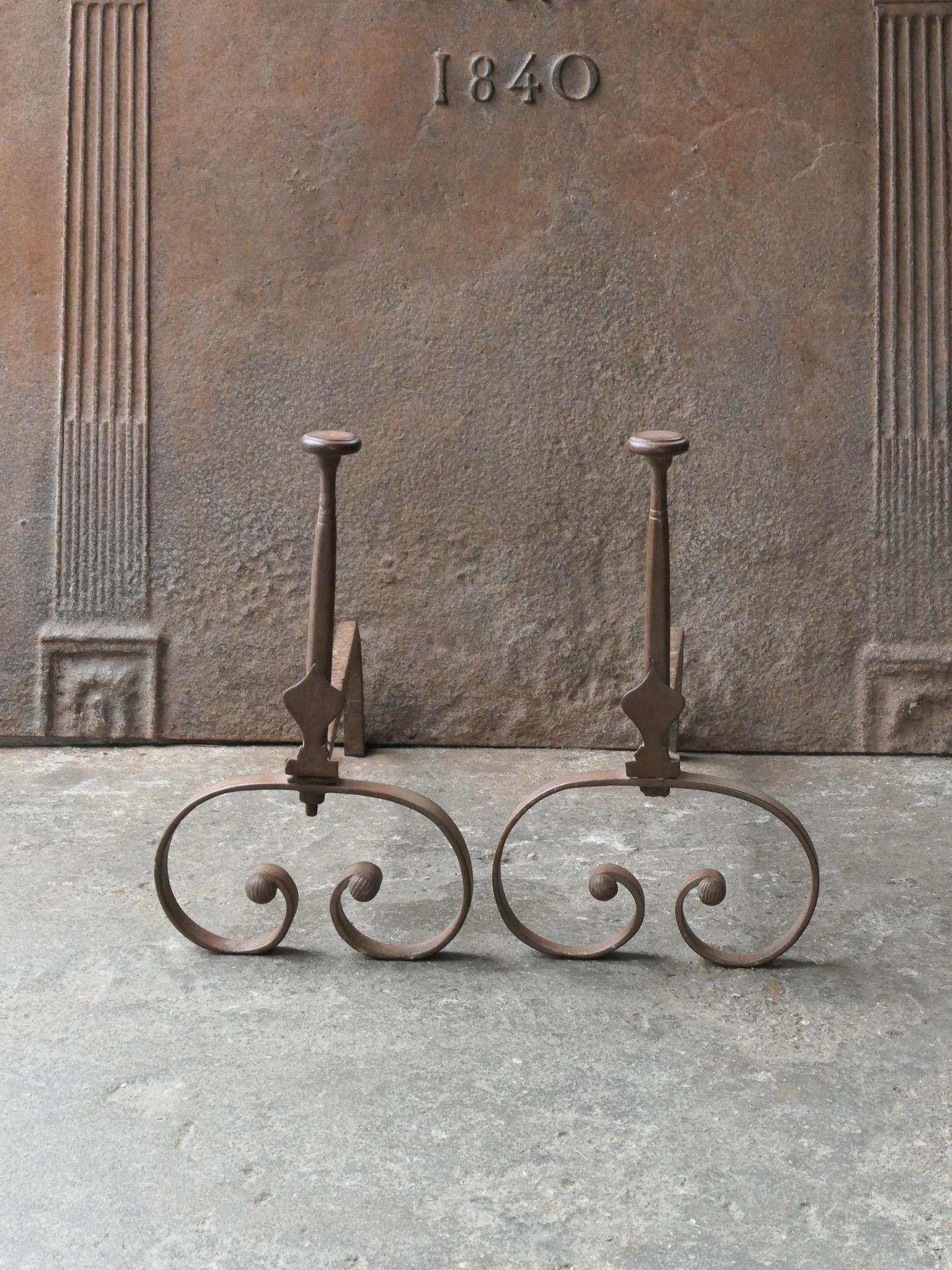 18th Century French Louis XV period andirons. Made of wrought iron.  The andirons are in a good condition and are fully functional. 