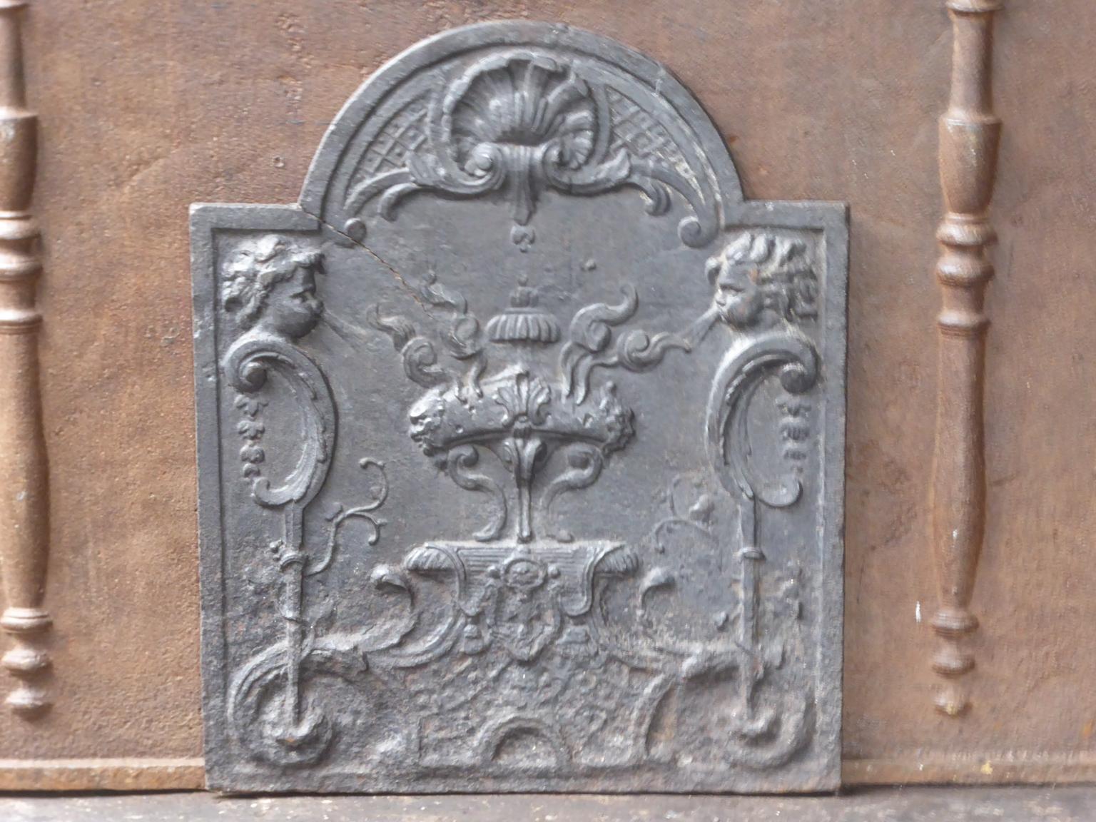 18th century French Louis XV fireback. 

The fireback is made of cast iron and has a natural brown patina. Upon request it can be made black / pewter. 







  
