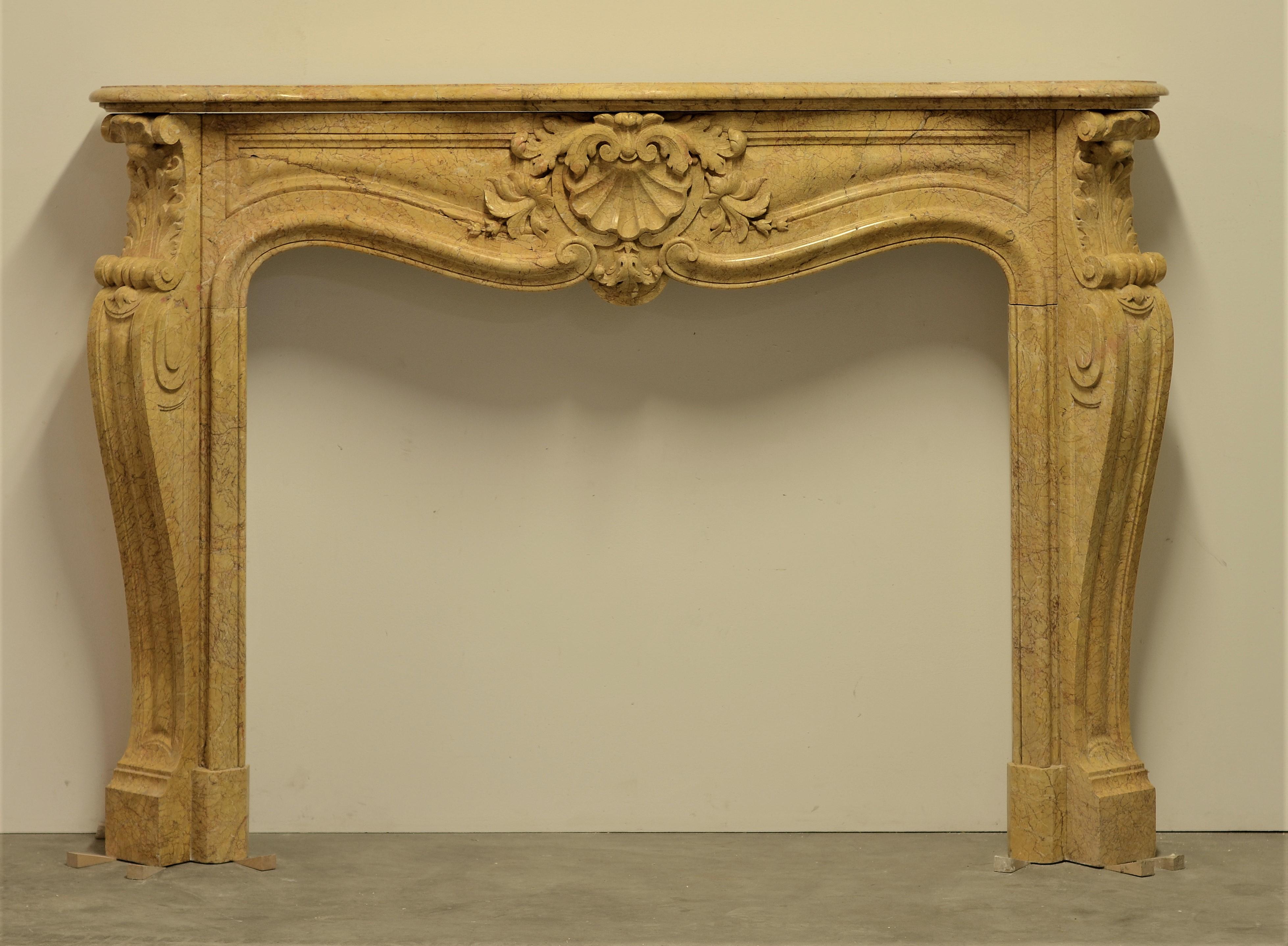 Impressive and well carved French Louis XV in Jeanne de Brignole marble.
The 19th century mantel is beautifully heavy florally decorated thru out.

Minor restorations, non original sides.

Sold by Schermerhorn antique fireplaces
Our vast