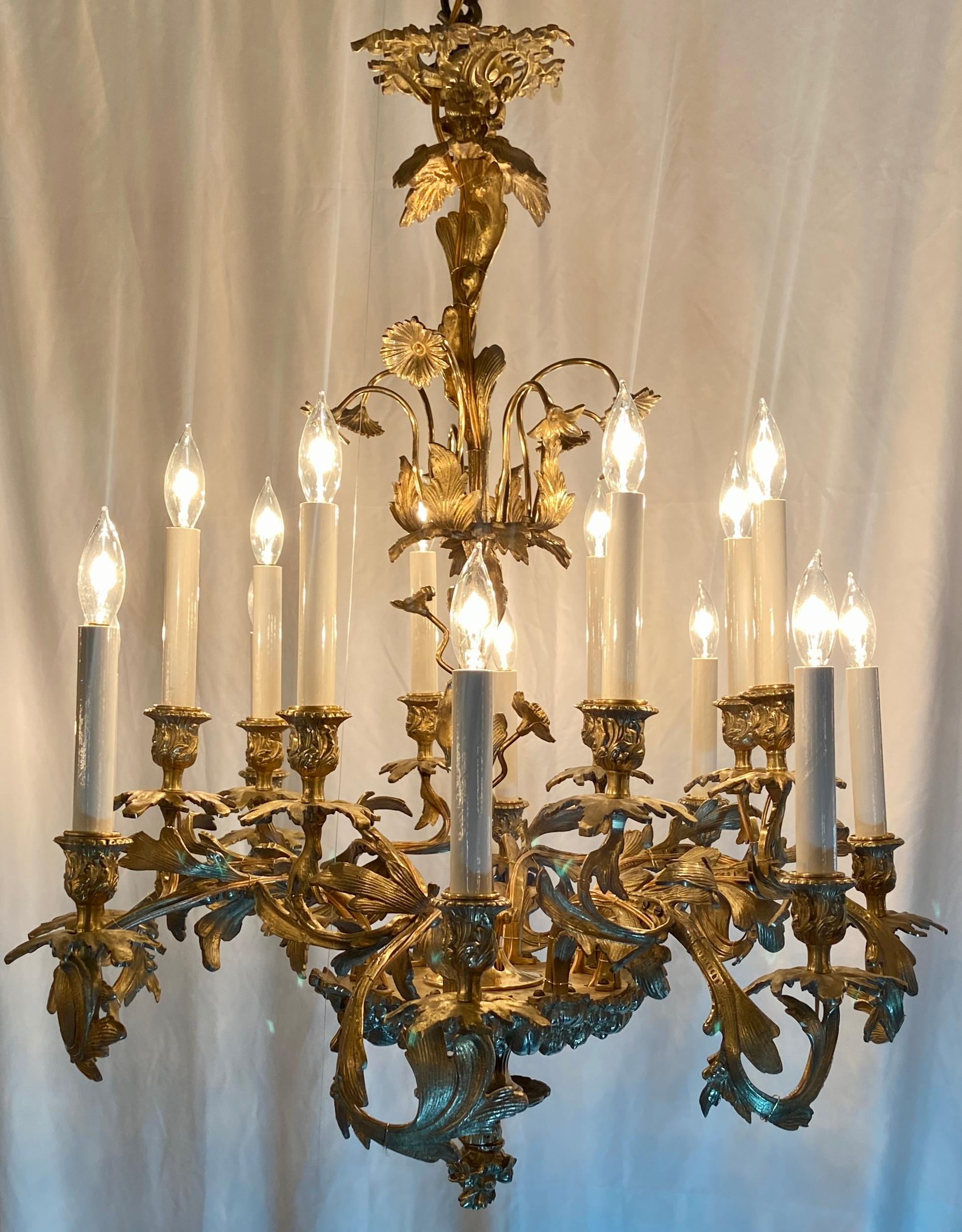 Wonderful Antique French Louis XV style gold bronze 12-light chandelier, circa 1890's.
Delicate Gold Bronze Flowers and Leaves throughout.