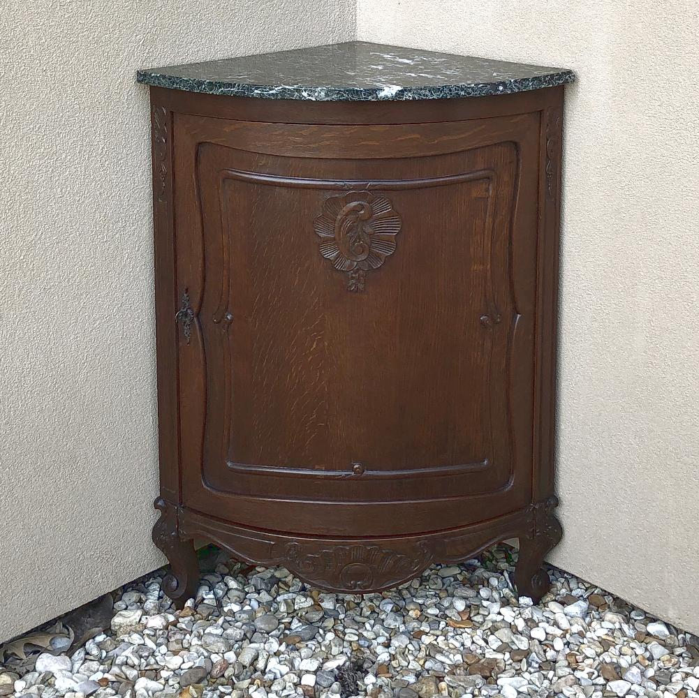 Antique French Louis XV marble-top corner cabinet, Confiturier is an unusual adaptation of the type, with a Country French overtone melded with the convenience of a corner piece that is topped with richly veined marble for an all-around winning