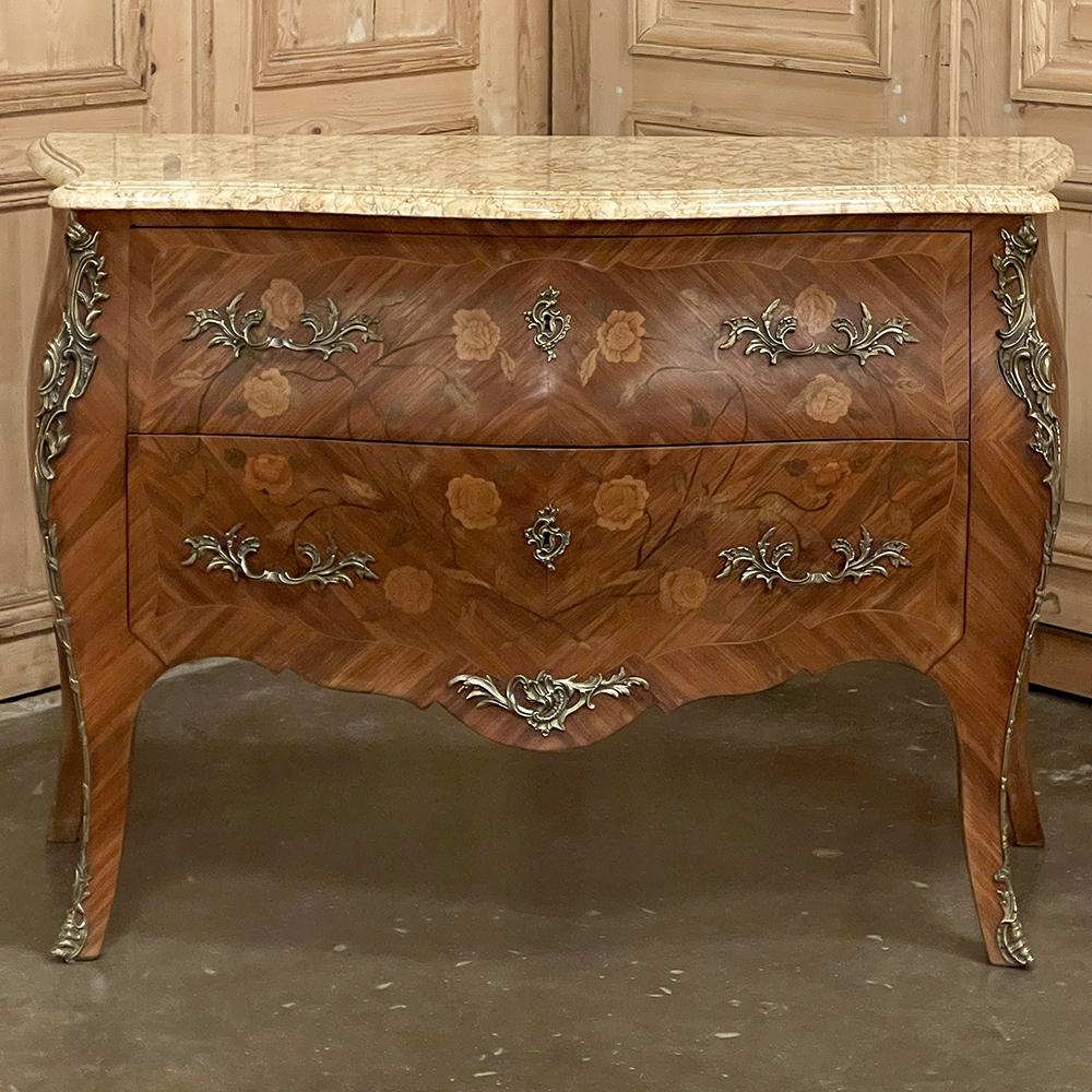 Requiring the talents of four master artisans, Antique French Marquetry Marble Top Bombe Commodes such as this example needed a talented menuisier to create the complex naturalistic, curved form of the casework utilizing time-honored techniques
