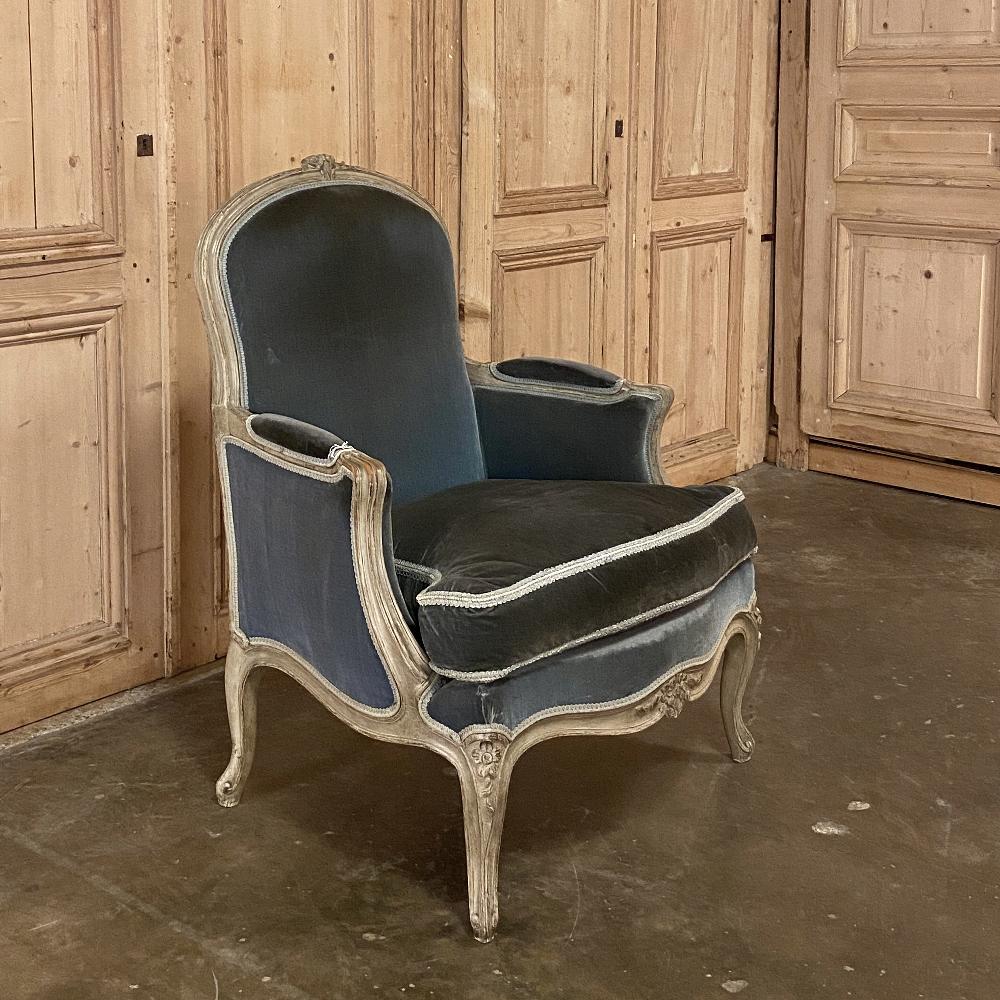 Antique French Louis XV Painted bergère is a study in elegance, with such a generous seat and padded armrests it invites you to sit down and relax! Such chairs were originally designed to envelope one in comfort, especially in older homes with