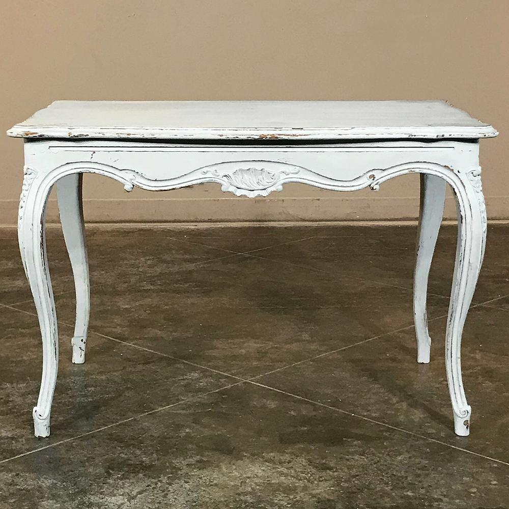 Antique French Louis XV painted end table is just the right size for any seating group, affording plenty of space for lamps, books, family photos and such, all with the naturalistic style of the Rococo. Patinaed painted finish adds a light and airy