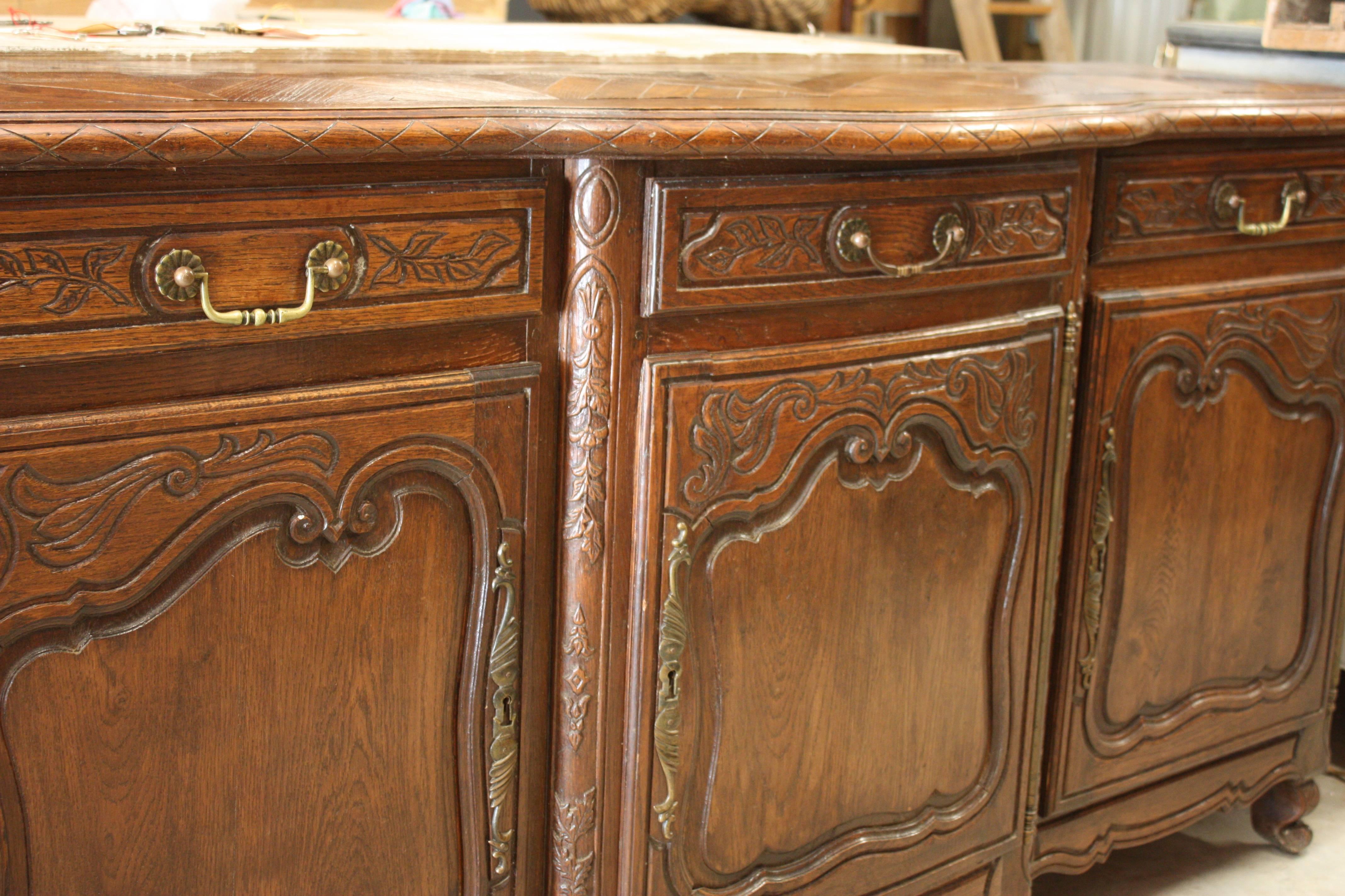 Antique French Louis XV period carved oak enfilade with beautiful carvings and parquet top. This piece will be a wonderful piece to anchor the design of a variety of rooms. Working keys and hardware included.
