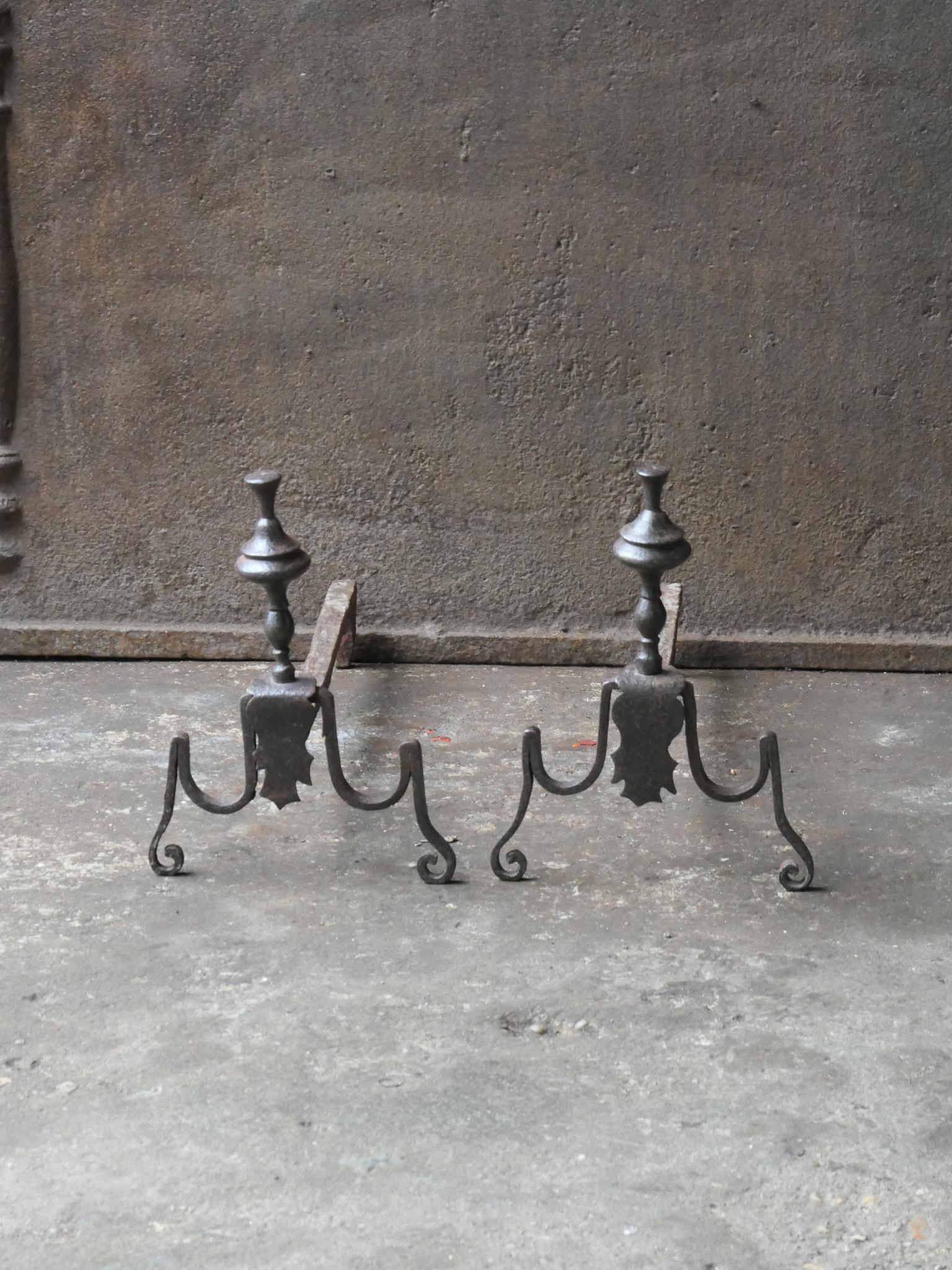 18th Century French Louis XV period andirons. Made of wrought iron.  The andirons are in a good condition and are fully functional. 