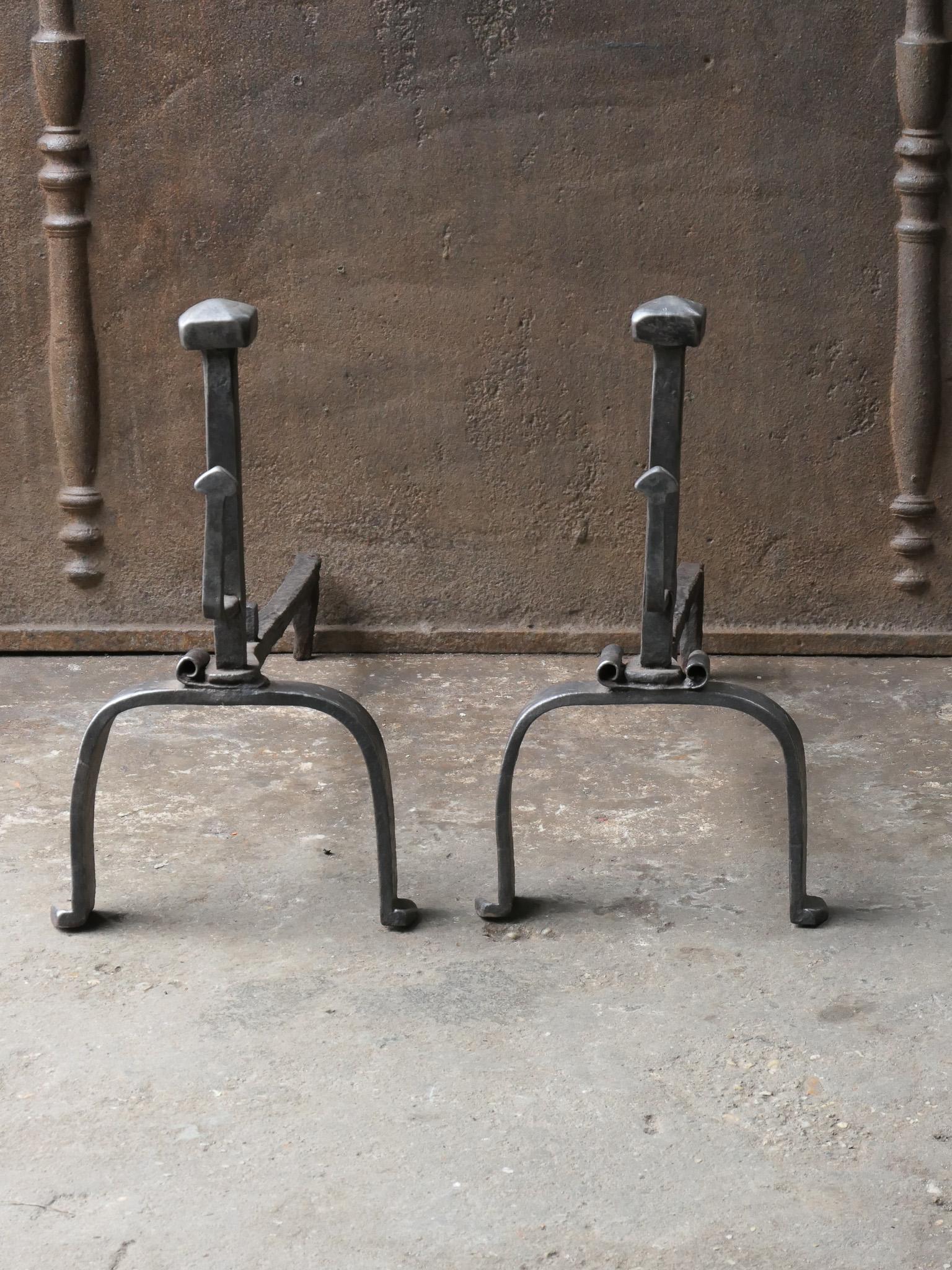 18th Century French Louis XV period andirons. Hand forged of wrought iron. The andirons have spit hooks. 

The andirons are in a good condition and are fully functional. 
