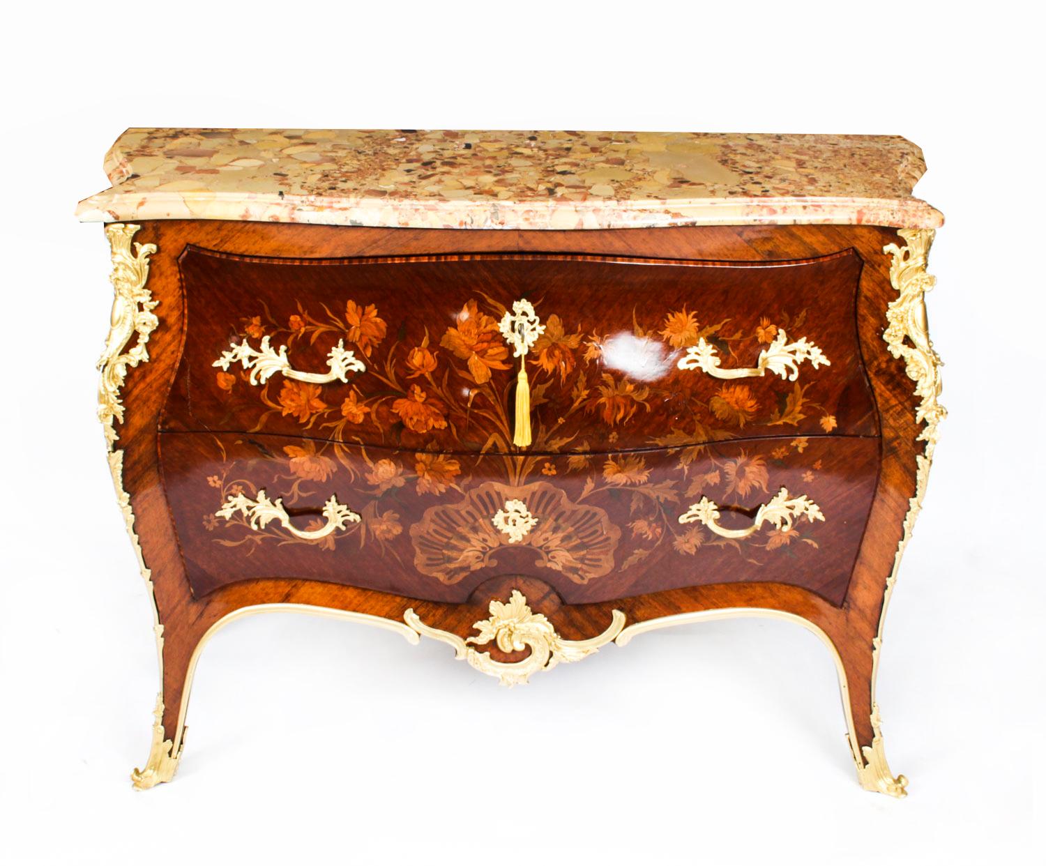 This is a beautiful antique French Louis XV Revival walnut and marquetry commode, circa 1860 in date.
 
It has a stunning shaped Italian Breccia marble top above two drawers finely inlaid with scrolling foliate and floral marquetry and featuring