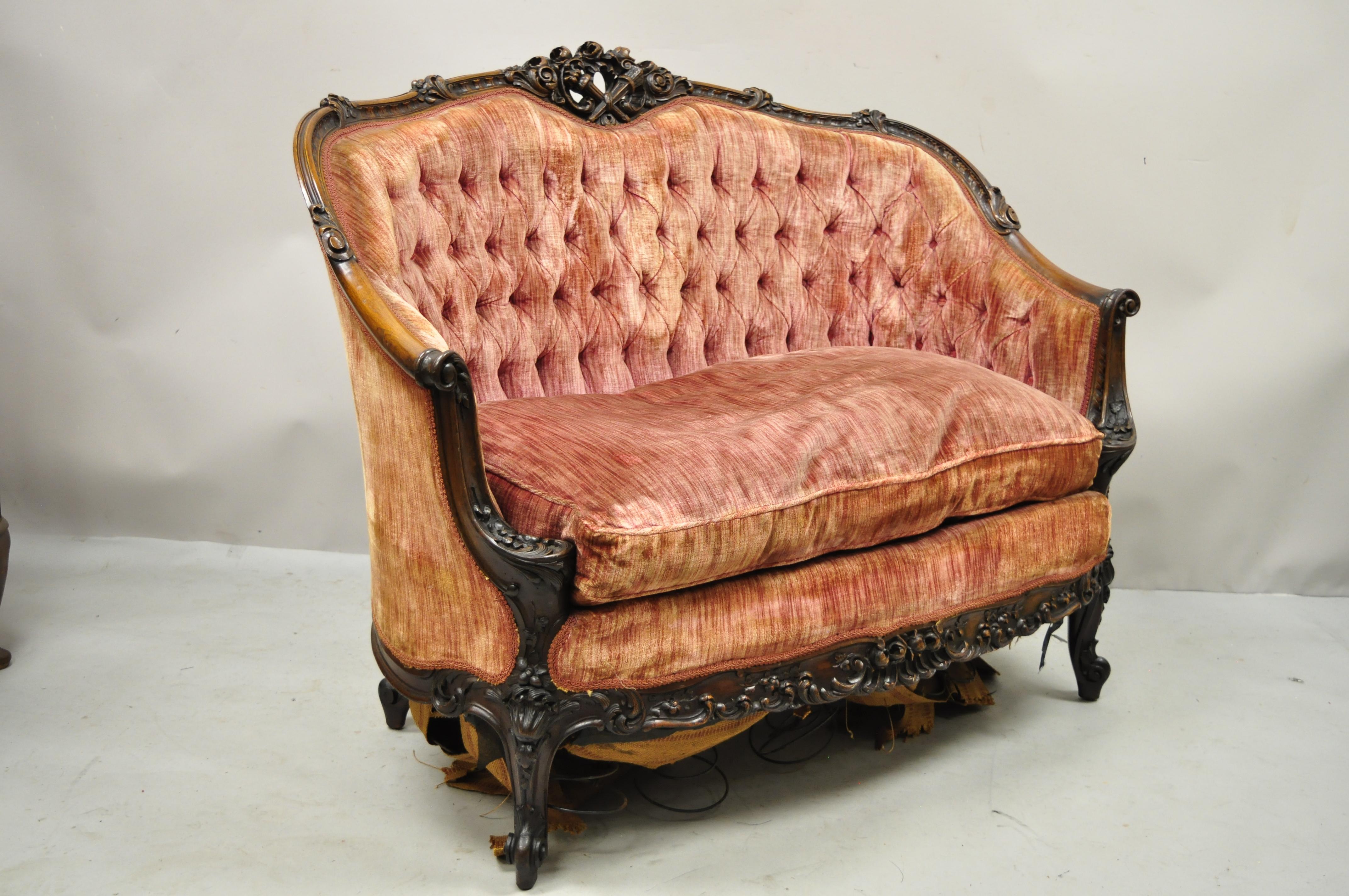 Antique French Louis XV Rococo Style ornate carved mahogany settee loveseat sofa. Item features remarkable and fine carvings throughout, solid wood frame, beautiful wood grain, cabriole legs, very nice antique item, great style and form. Circa Early