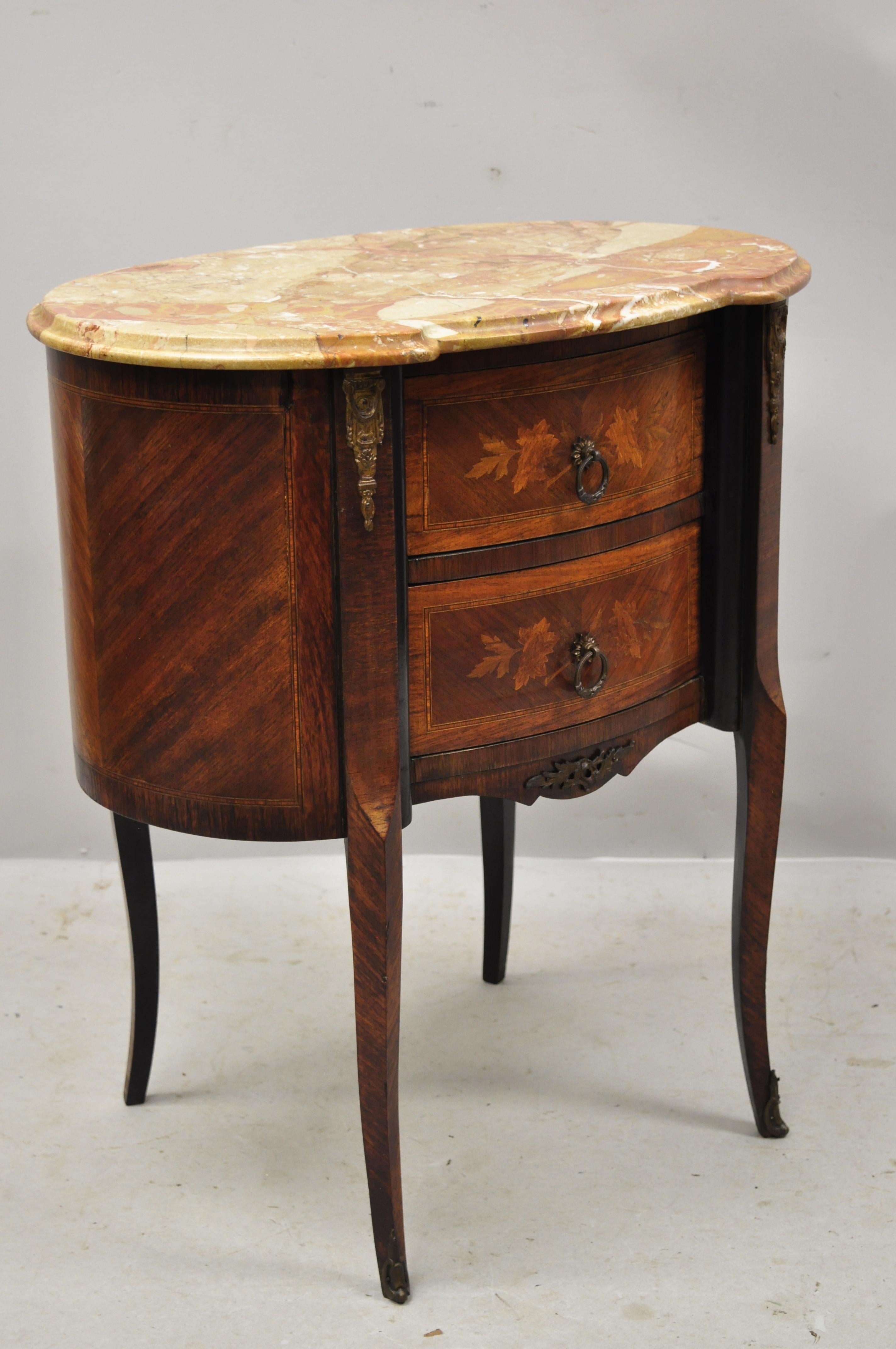 Antique French Louis XV rogue marble-top floral inlay bombe nightstand table. Item features shaped Italian marble top, bronze ormolu, floral satinwood inlay, beautiful wood grain, 2 dovetailed drawers, cabriole legs, very nice antique item, circa