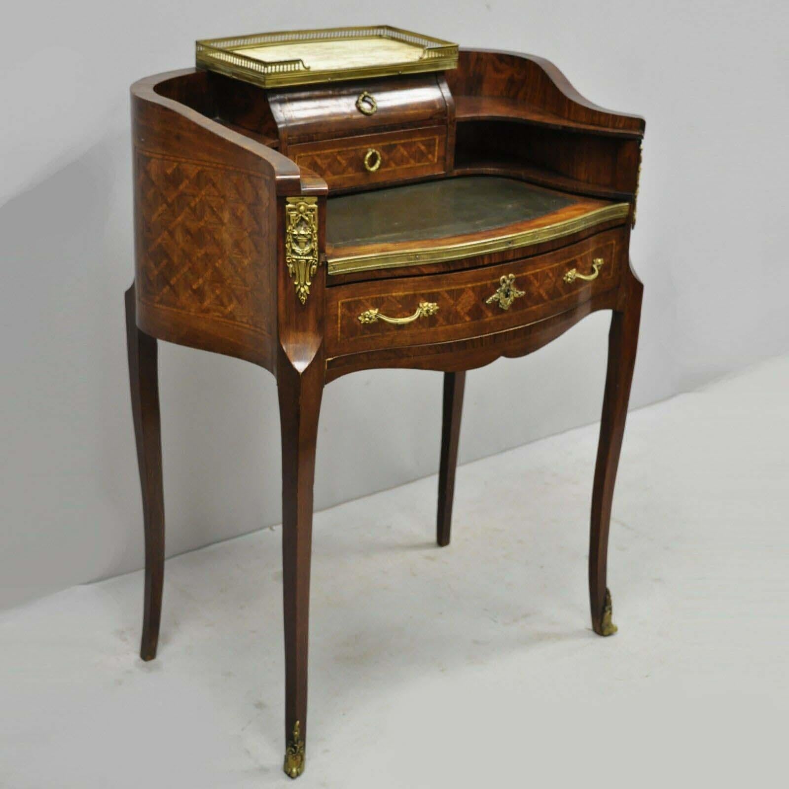 Antique French Louis XV style small inlaid petite Demilune writing desk, made in France. Item features marble top, green leather pullout or pull-out writing surface, inlaid all the way around, bronze ormolu, no key, but unlocked, 3 dovetail drawers,