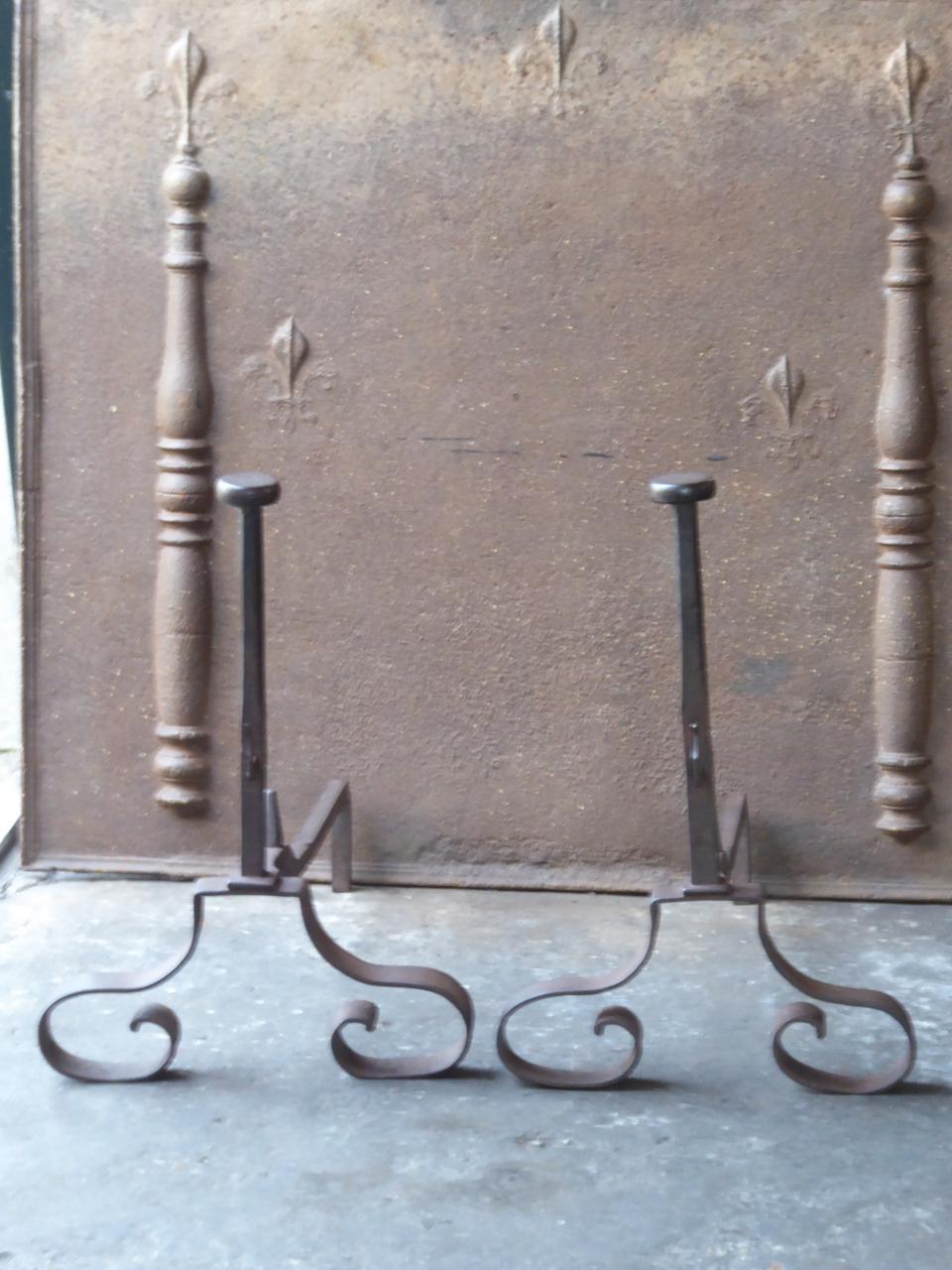 19th century French Louis XV style andirons made of wrought iron. The condition is good.







    