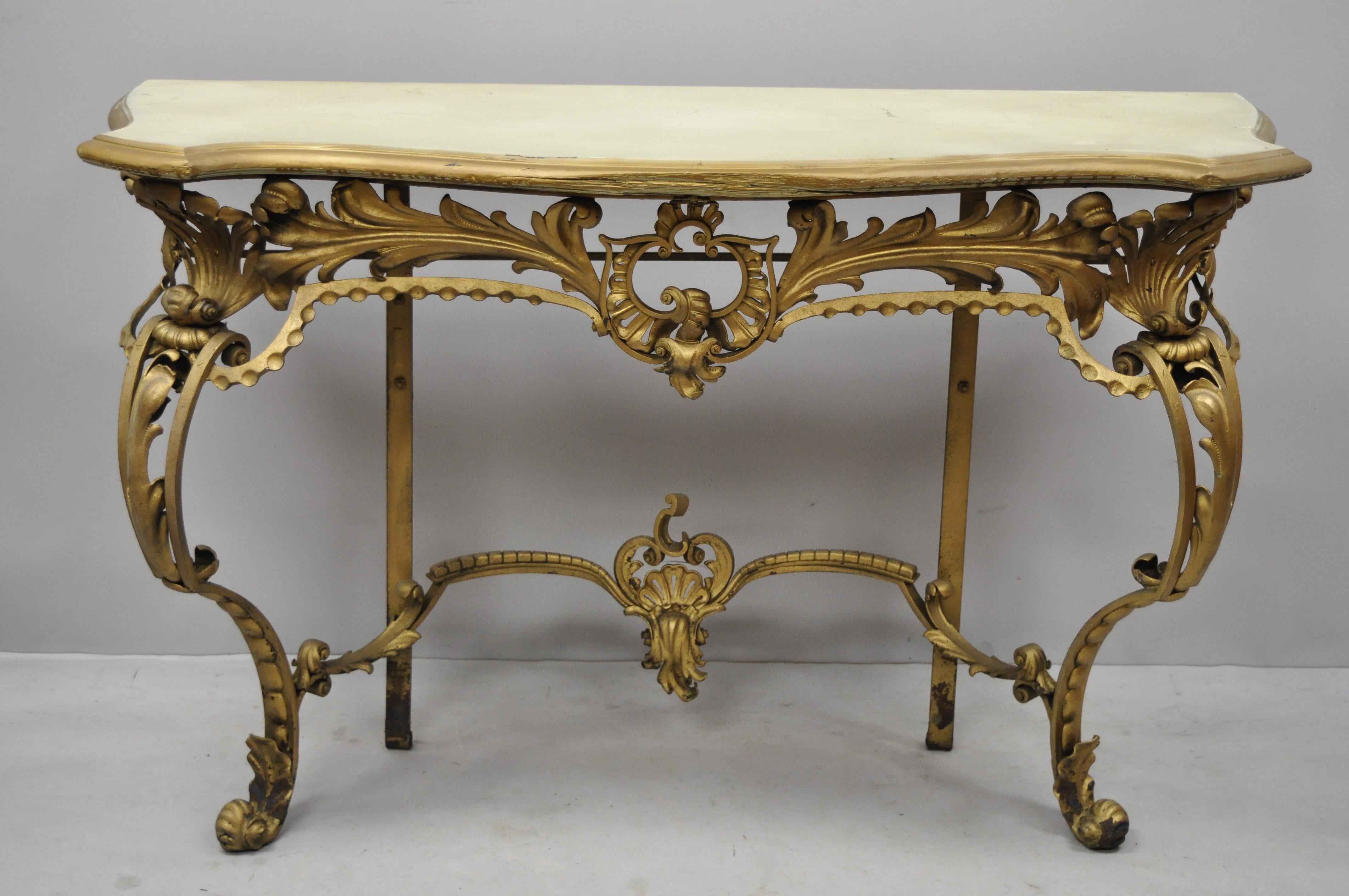 Antique French Louis XV style Art Nouveau console table with wooden top. Item features solid wood serpentine top, wrought iron base, floral scrollwork, very nice antique item, quality craftsmanship, circa 1900. Measurements: 33