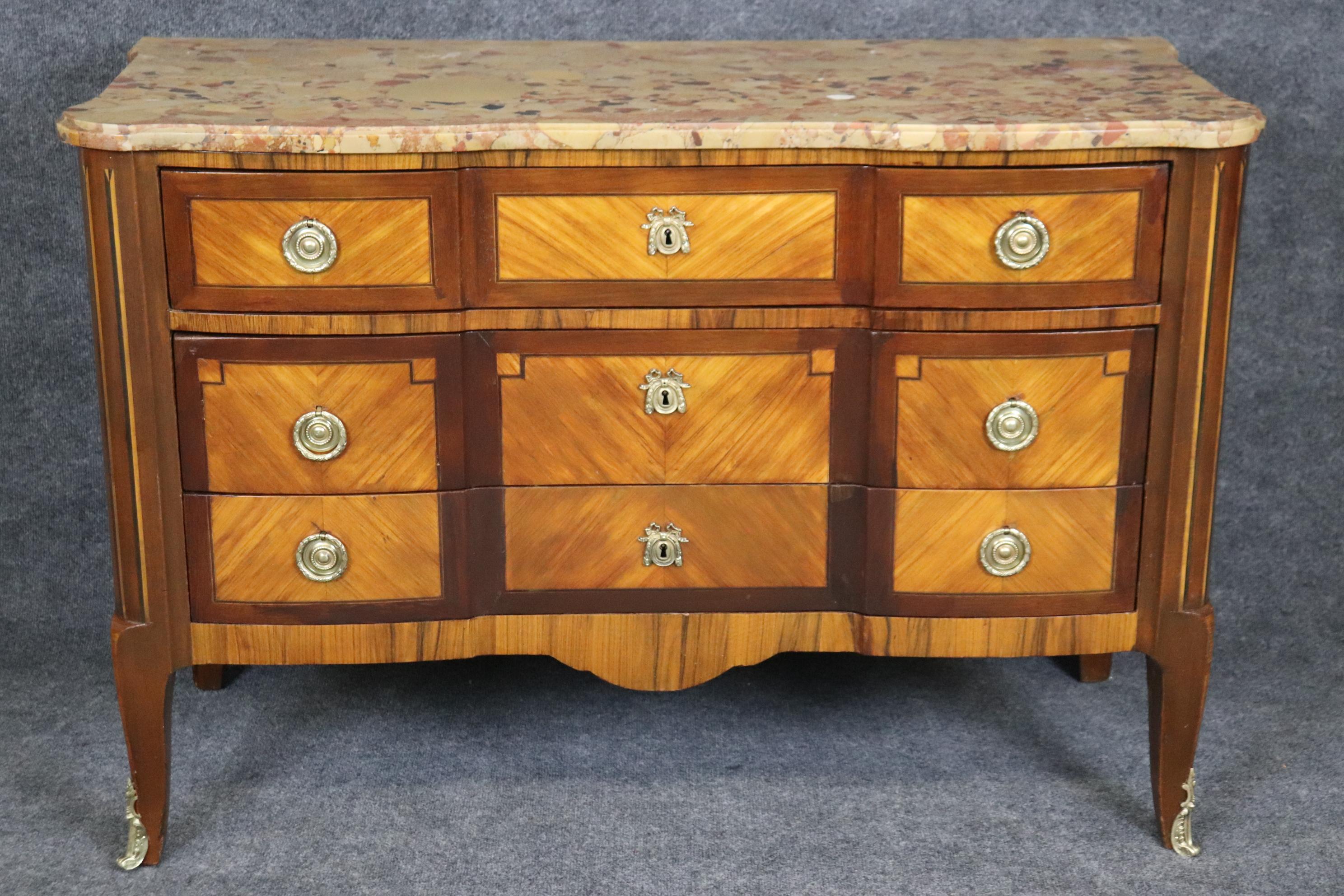 Dimensions: Height: 33 3/4 in Width: 49 1/4 in Depth: 21 in 

This antique French Louis XV style inlaid marble top commode, dresser, chest of drawers is a great example of quality French furniture! If you look at the photos provided, you will see