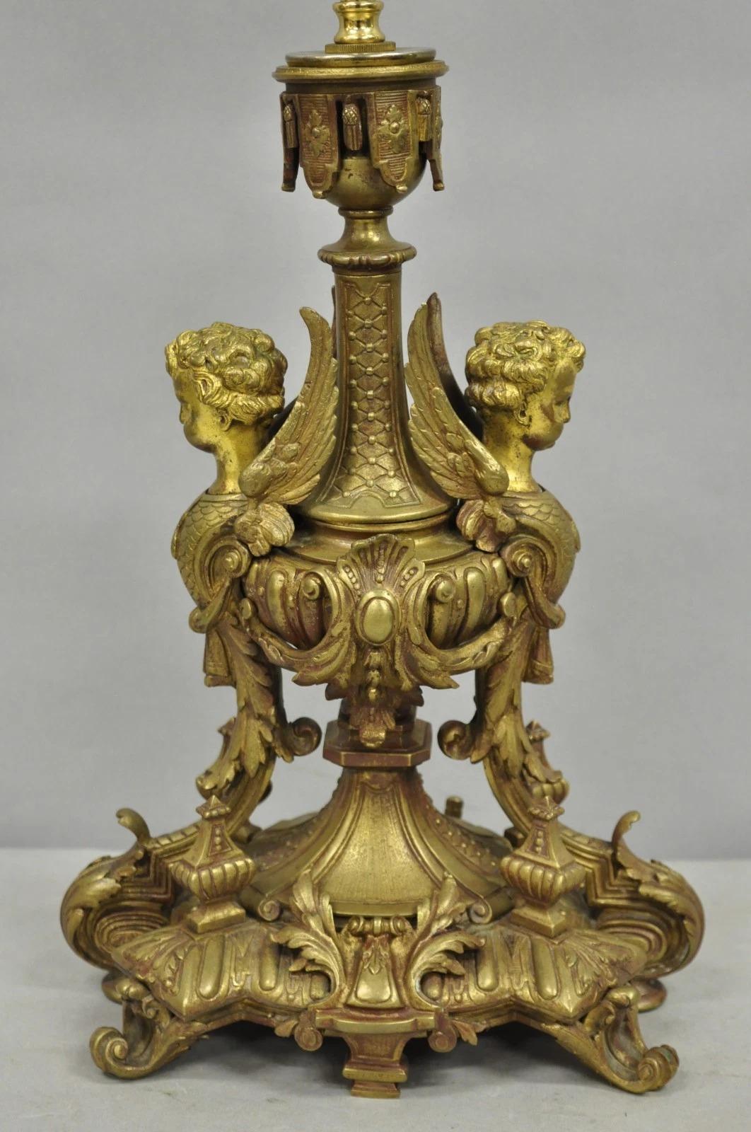 Antique French Louis XV Style Heavy Bronze Figural Double Winged Cherub Sculpture Table Lamp with Lion Mask to Rear (see pics 9 & 10). Circa Late 19th Century. Measurements: 26