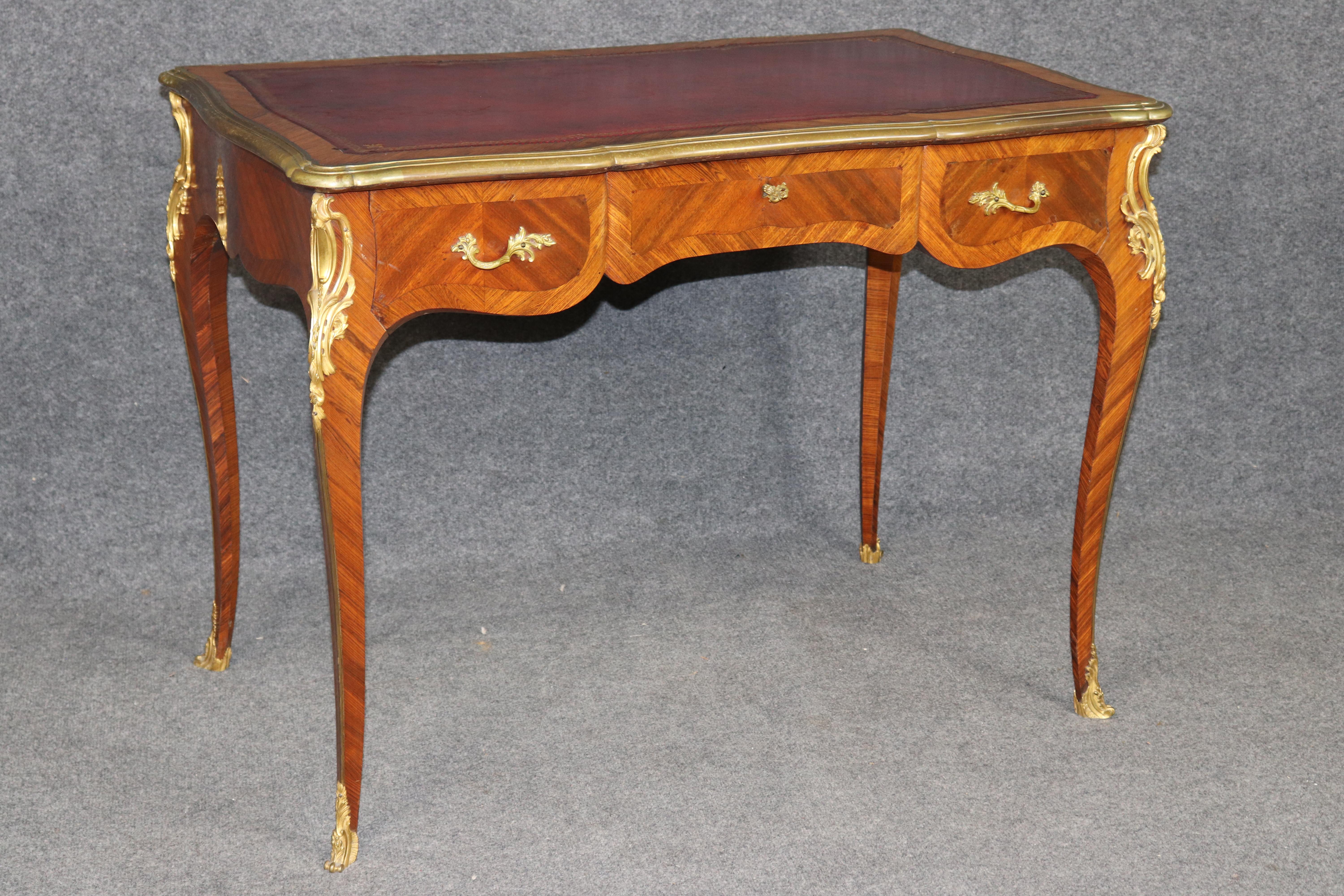 Dimensions - H: 29 1/4 in W: 39 3/4 in D: 23 1/2 in 

An outstanding Antique French Louis XV style bronze-mounted leather top desk, dating to the turn of the 20th century and signed Billen Paris. Billen was a highly regarded French retailer active