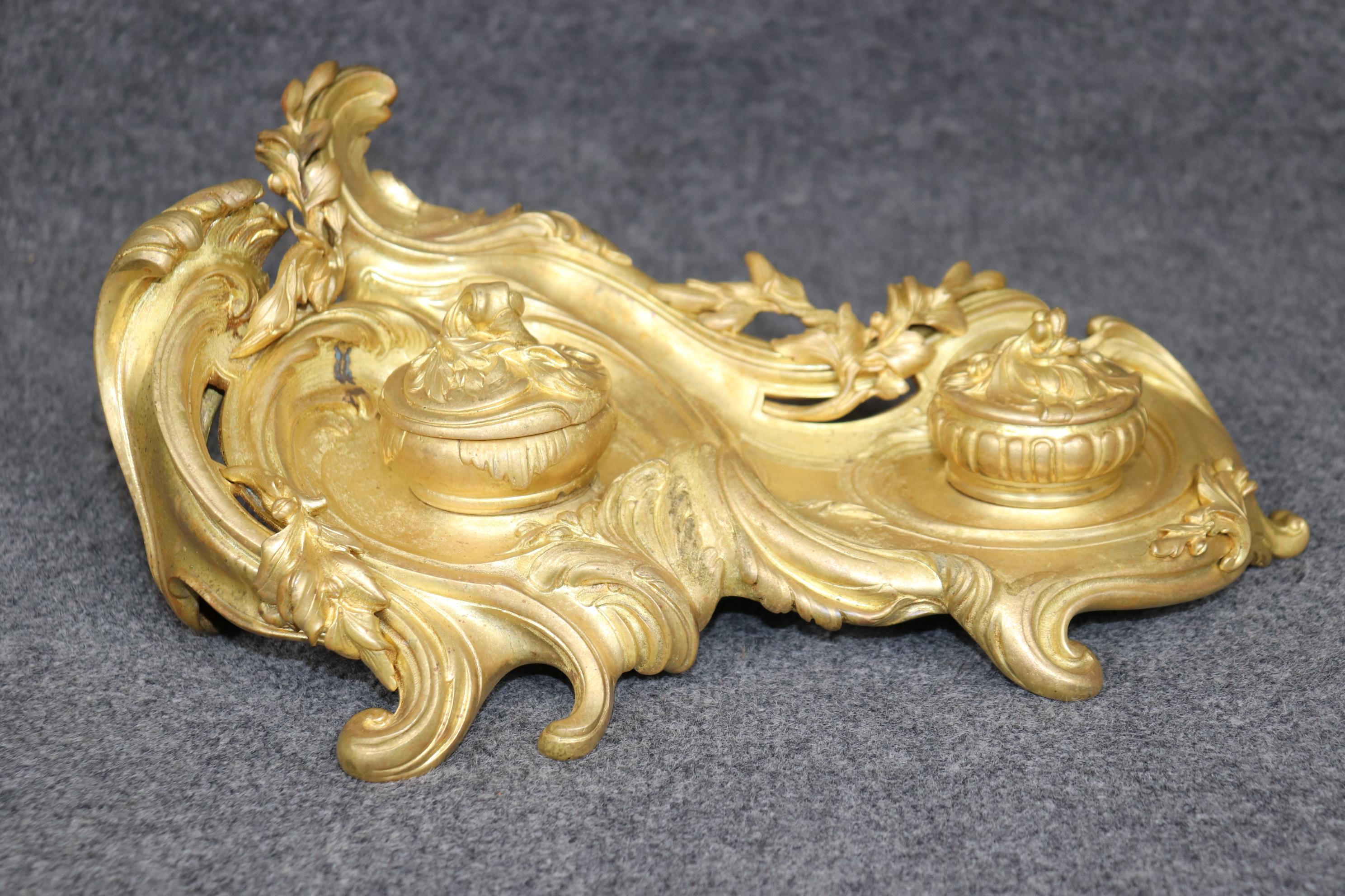 Dimensions: Height: 6 1/2 in Width: 15 3/4 in Depth: 9 in 

This antique French Louis XV style bronze ormolu inkwell is truly a sight to be seen! If we take a look at the photos provided we can see the inkwell is signed 