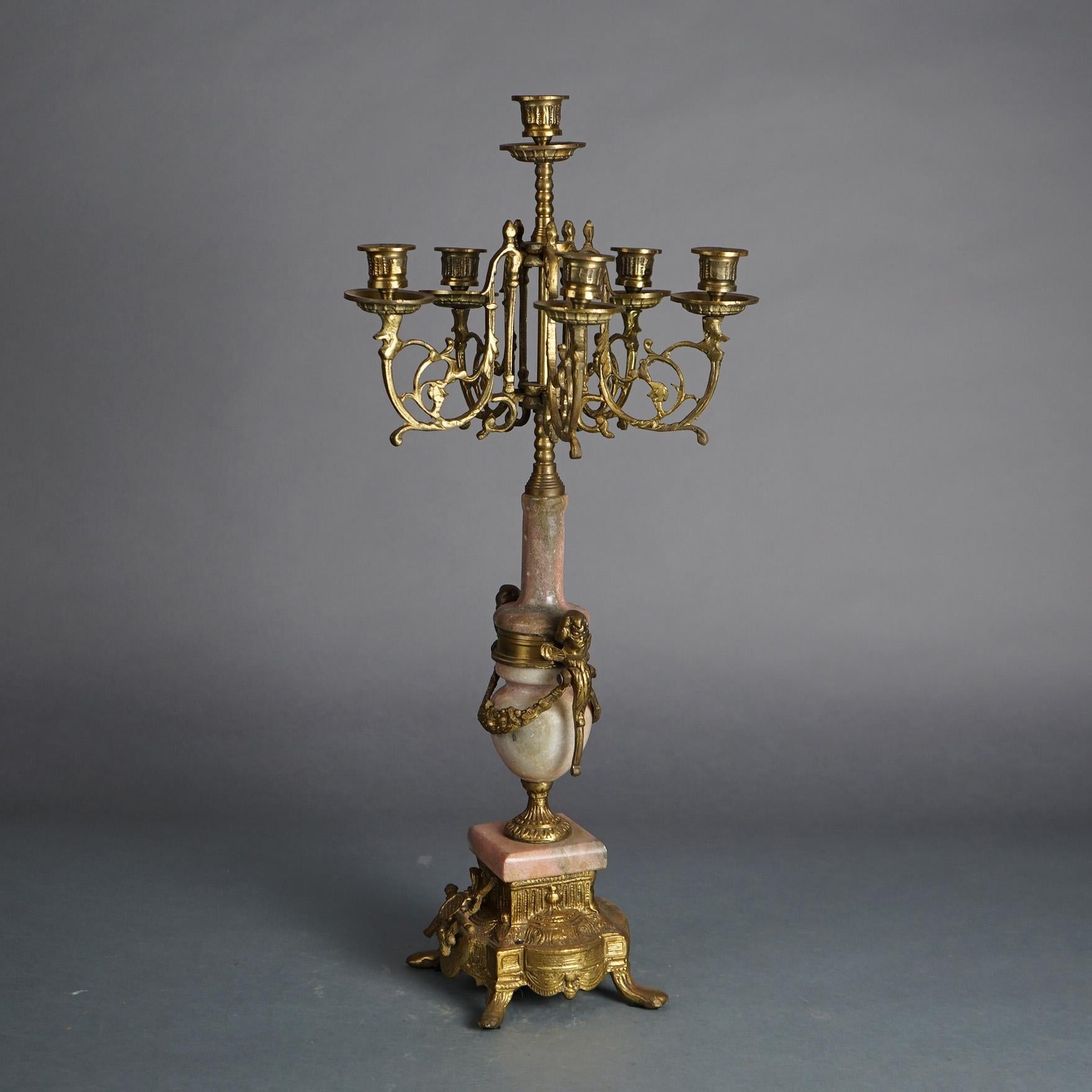 Antique French Louis XVI Style Foliate Cast Bronze & Rouge Marble Six-Light Figural Candelabra with Urn Form Base and Cherubs C1920

Measures- 25''H x 11''W x 11''D
