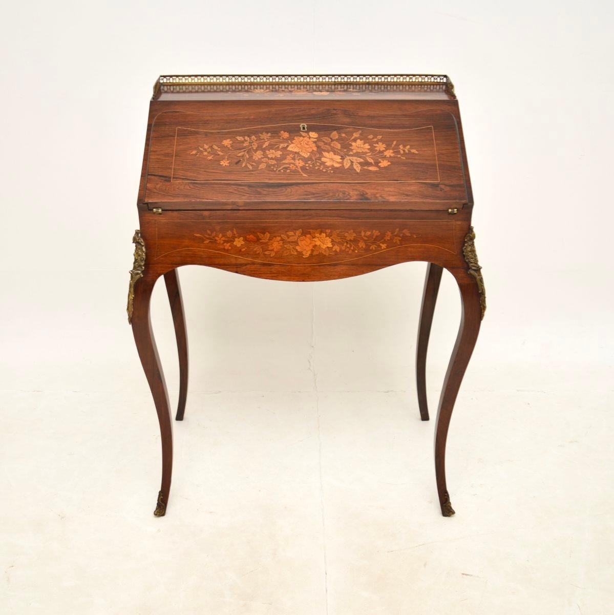 A stunning antique French bureau, dating from around the 1890-1910 period.

It is of extremely fine quality, standing on slender yet sturdy cabriole legs and with gorgeous inlaid floral patterns. There are high quality ormolu mounts and this
