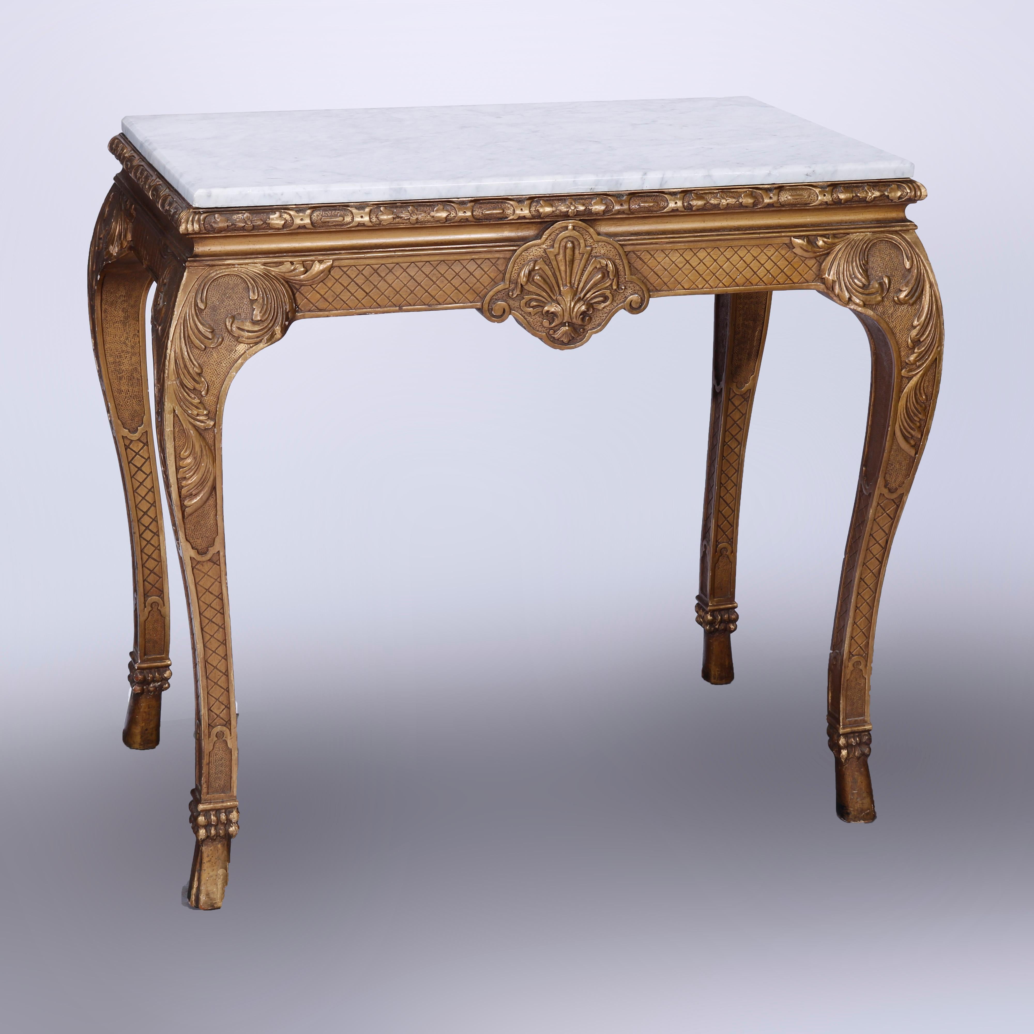 An antique French Louis XV style console table offers marble top over giltwood frame base having incised lattice design, central carved shell, raised on cabriole legs with acanthus knees terminating in stylized hoof feet, 19th century

Measures -