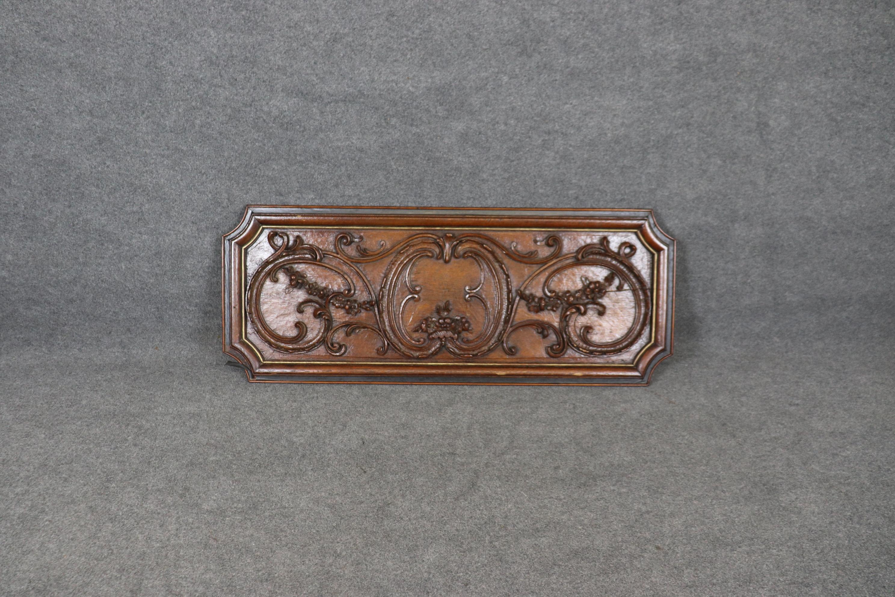 This is a superbly carved enormous carved boiserie panel that would be perfect for using over an entryway door in a room or as a substitute for a painting or hanging architectural element. This is a piece from the 1800s era and is in good condition.