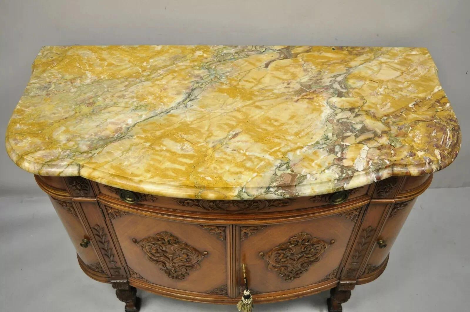 Antique French Louis XV Style Carved Walnut Marble Top Buffet Sideboard Cabinet. Item features a shaped rouge marble top, 4 swing doors, 5 dovetailed drawers, quality French craftsmanship. Circa Early 20th Century. Measurements: 36.5