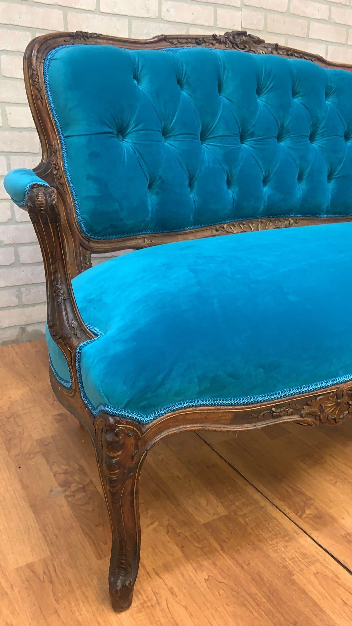Antique French Louis XV Style Hand Carved Walnut Floral Motif Tufted Back Settee Newly Reupholstered in a Teal Velvet in the Front with a Patterned Gold and Teal Velvet in the Back 

A gorgeous settee of fine quality with beautiful floral