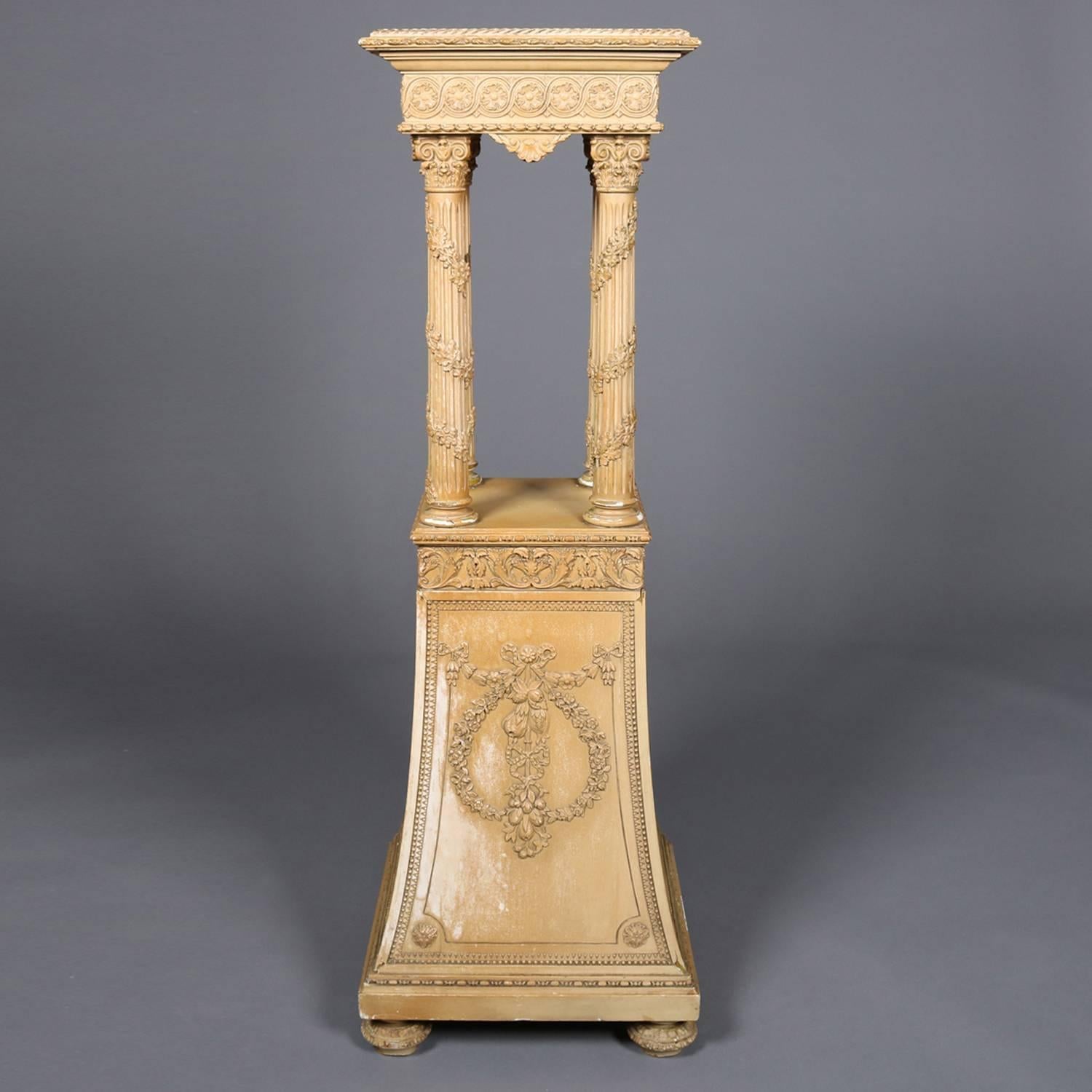 Antique French Louis XV style painted carved wood and gesso sculpture stand features display raised on garland wrapped Corinthian column supports atop flared plinth with garland foliate wreath reserves, circa 1900

Measures: 45