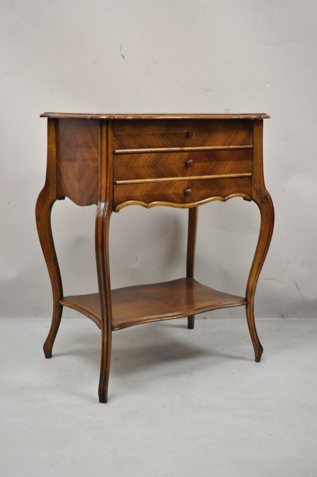 Antique French Louis XV style Mahogany sewing stand nightstand with lift top. Item features marquetry inlay lift up lid, beveled glass mirror, interior with compartments, beautiful wood grain, working lock and key, cabriole legs. Circa Early 1900s.