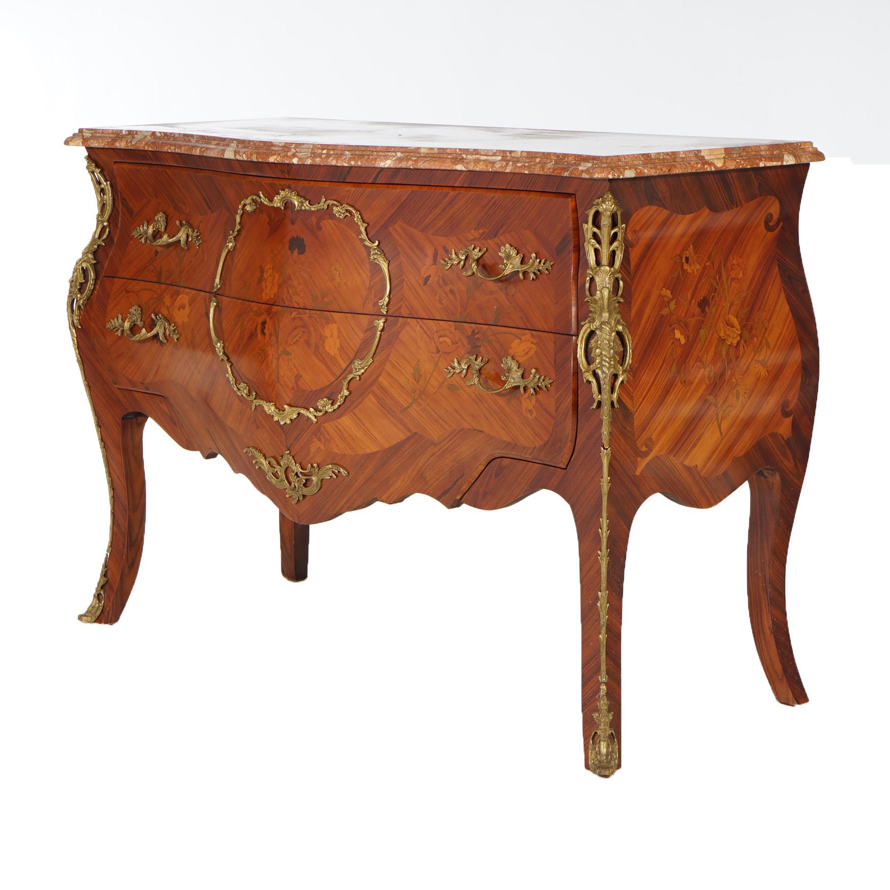An antique French Louis XV style commode offers rouge marble top over kingwood case with satinwood marquetry and cast ormolu mounts, raised on cabriole legs, 20th century

Measures -35.5