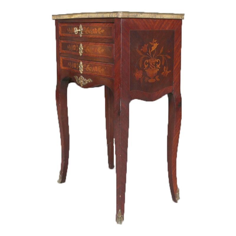 Antique French Louis XV style end stand features mahogany case with three drawers, each having satinwood inlaid bookmatched foliate marquetry and cast bronze escutcheon over scalloped apron having cast bronze foliate attachment and raised on