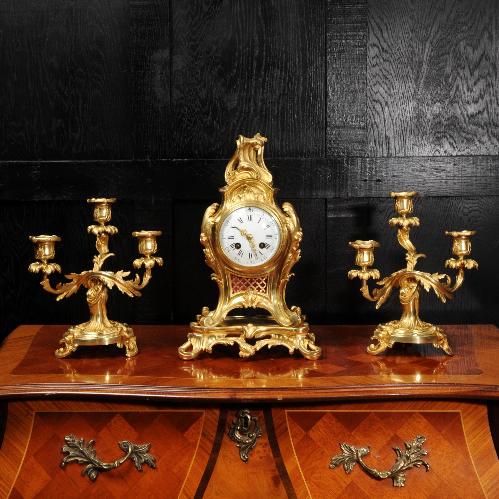 A very fine ormolu Rococo clock set by Charles Hour, circa 1880. It is beautifully modelled in the Rococo style of Louis XV in Ormolu (finely gilded bronze). Beautiful balloon shaped case with acanthus to the shoulders and a Rococo flourish to the