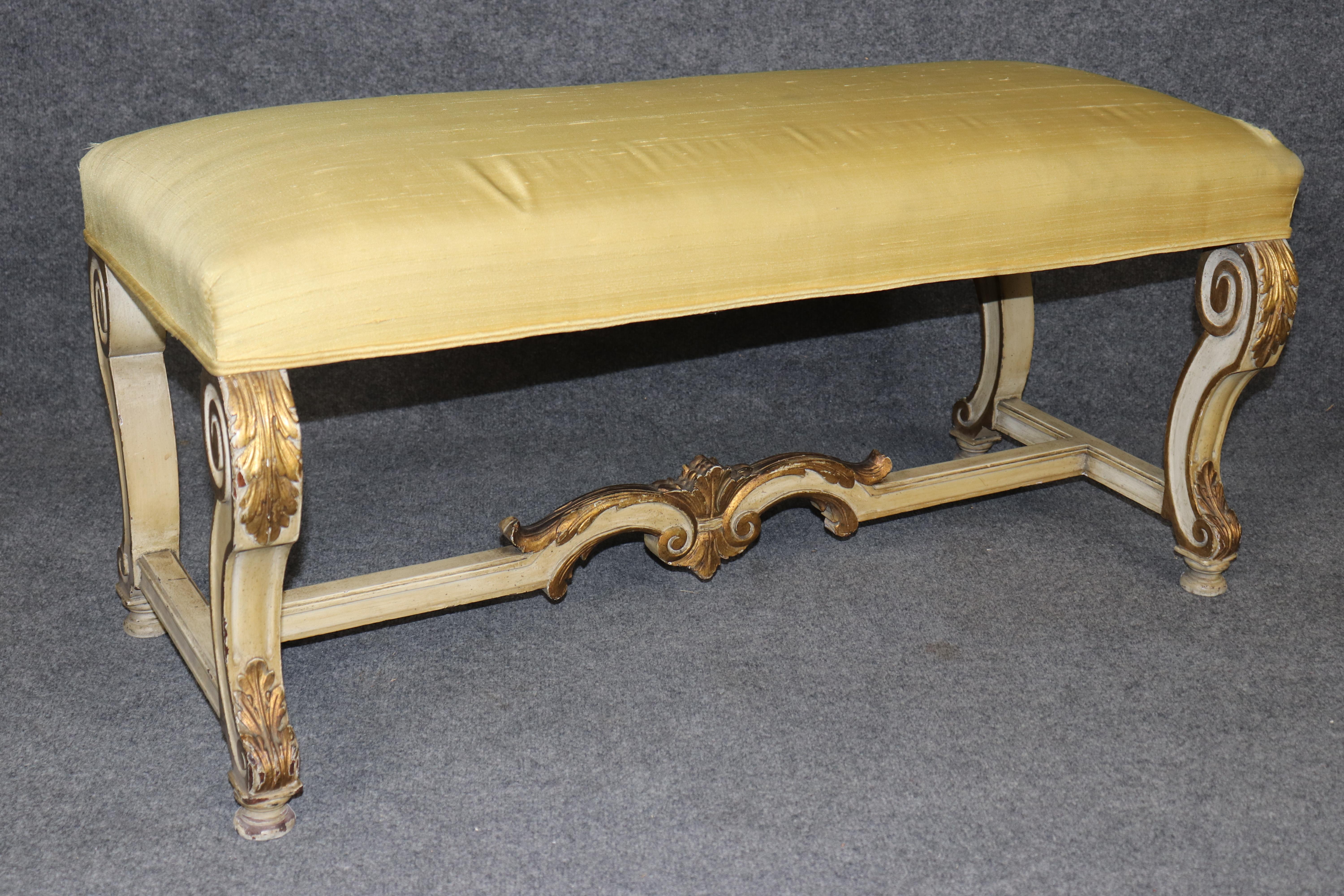 Dimensions - H: 19 1/2 in W: 40 1/2 in D: 18 in 

Elevate your space with the refined elegance of this Antique French Louis XV Style Bench, dating to the 1920s. A beautiful example of early 20th-century craftsmanship, this bench is gracefully
