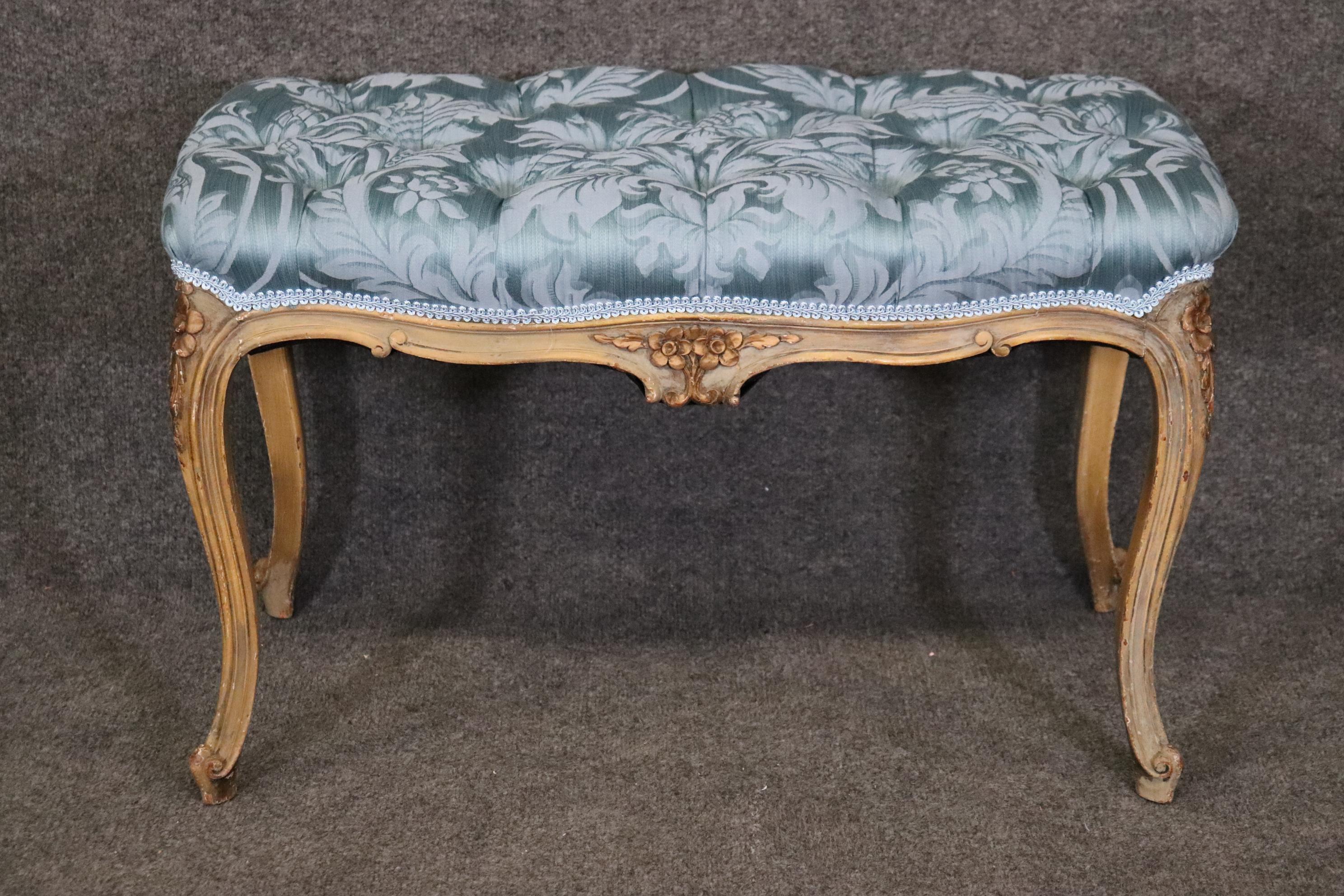 Dimensions- H: 18 1/4in W: 30in D: 16 3/4in 
This Antique French Louis XV Style Paint Decorated Tufted Bench, Footstool is a nice example of what luxurious furniture was like during the late 19th and early 20th century. This bench or footstool is