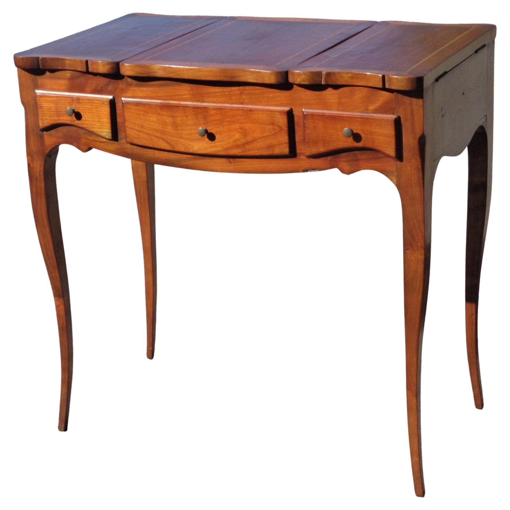 Antique French Louis XV style fruitwood poudreuse with fine parquetry inlay three section top, serpentine front and sides, very elegant long curvaceous cabriole legs, compartmentalized interior, two drawers w/ dovetail construction, one false