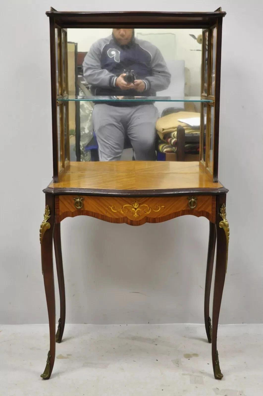 Antique French Louis XV Style Petite Curio Etagere with Satinwood Inlay & Mirror. Item features a mirror back, bronze ormolu, satinwood inlay, nice petite size, one drawer, one glass shelf, cabriole legs, very nice antique item. Circa Early 20th