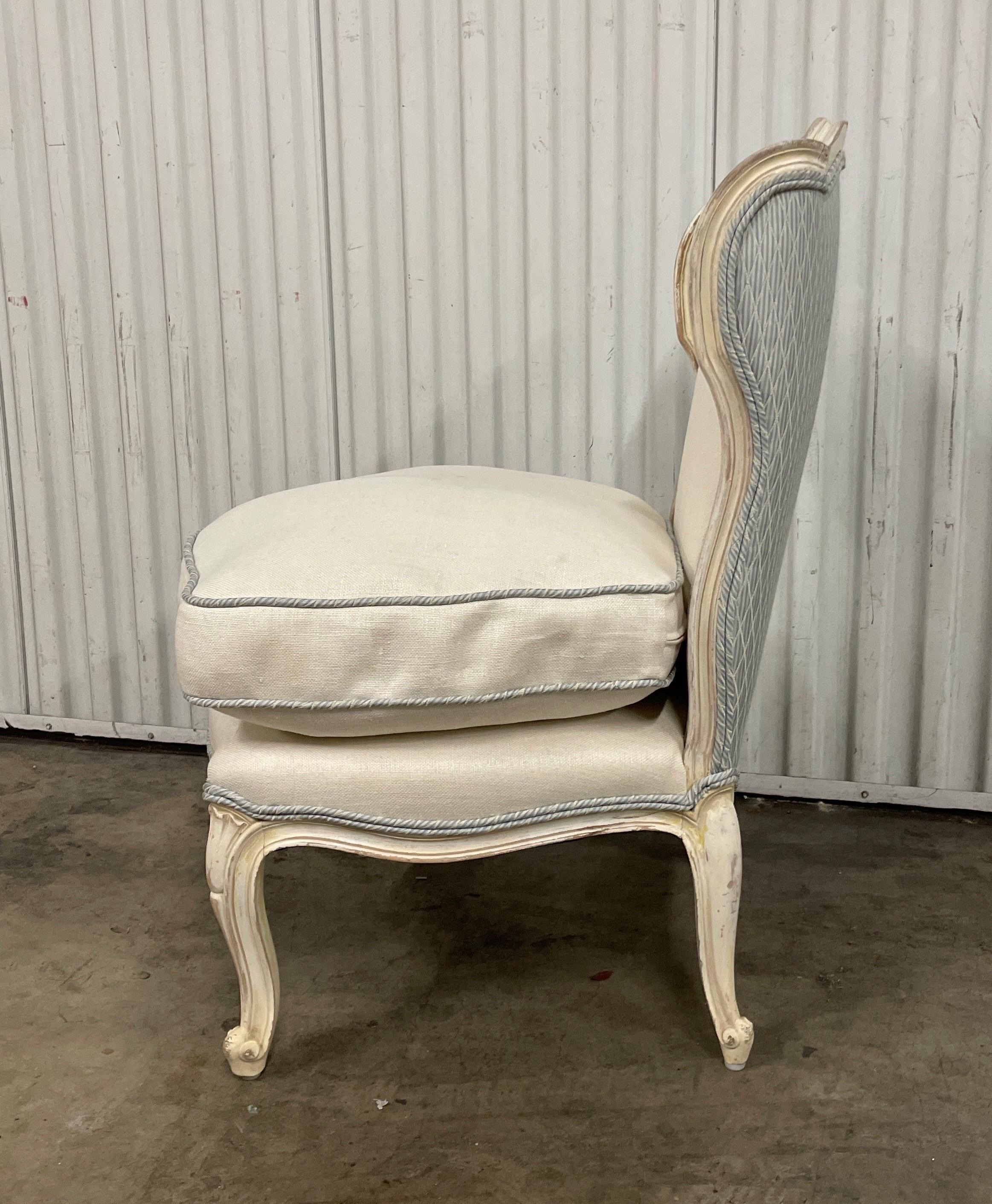 Very sweet Louis XV style French slipper chair newly upholstered in white fabric with blue silk back & welting. Sumptuous down seat cushion.